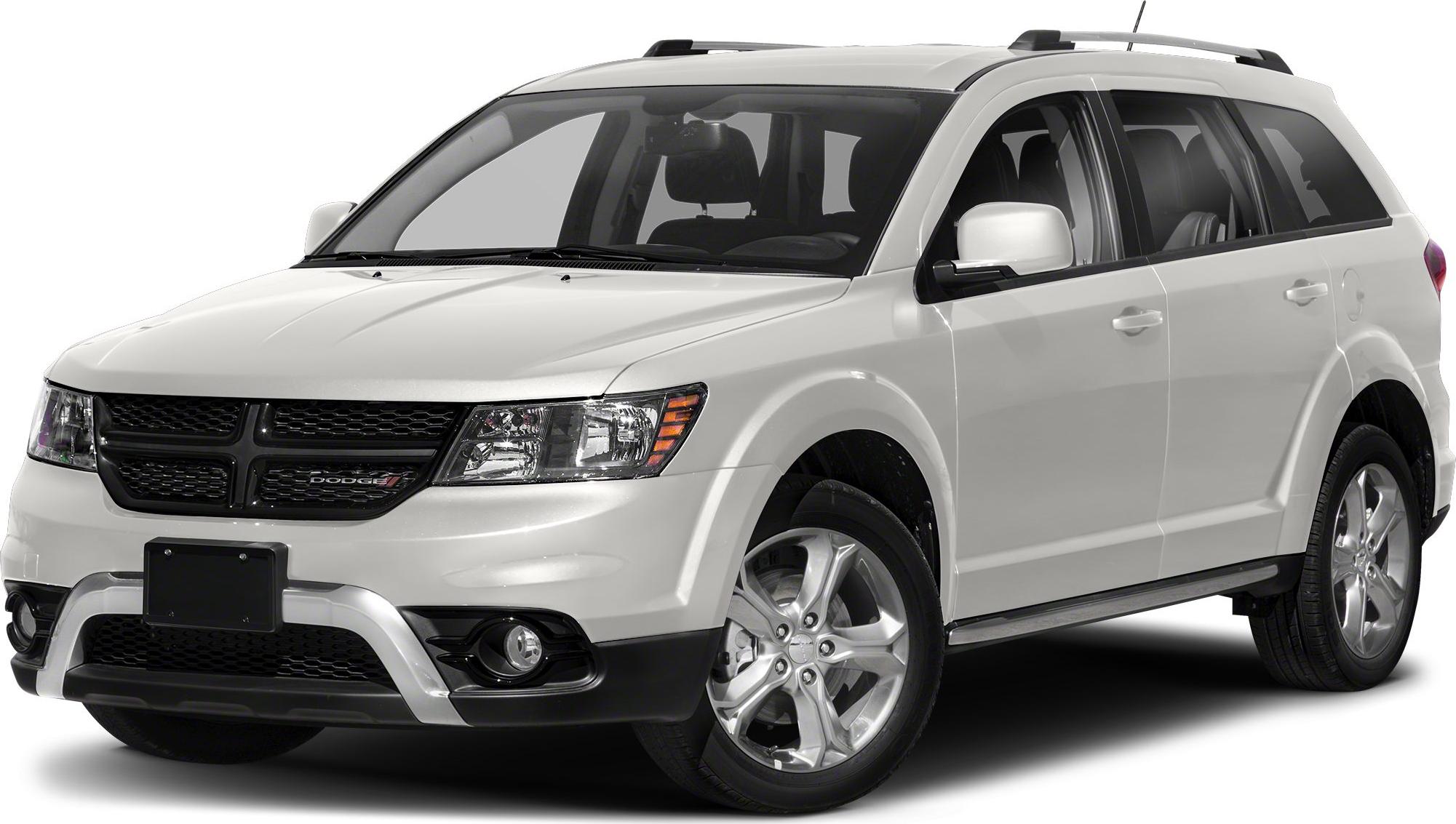 Front side view with grille, headlights, fog lights, and alloy wheels.