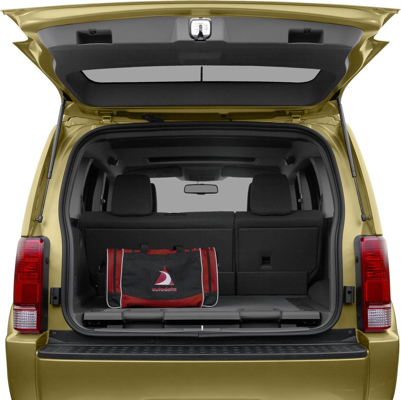Open rear hatch with cargo space and passenger seats visible