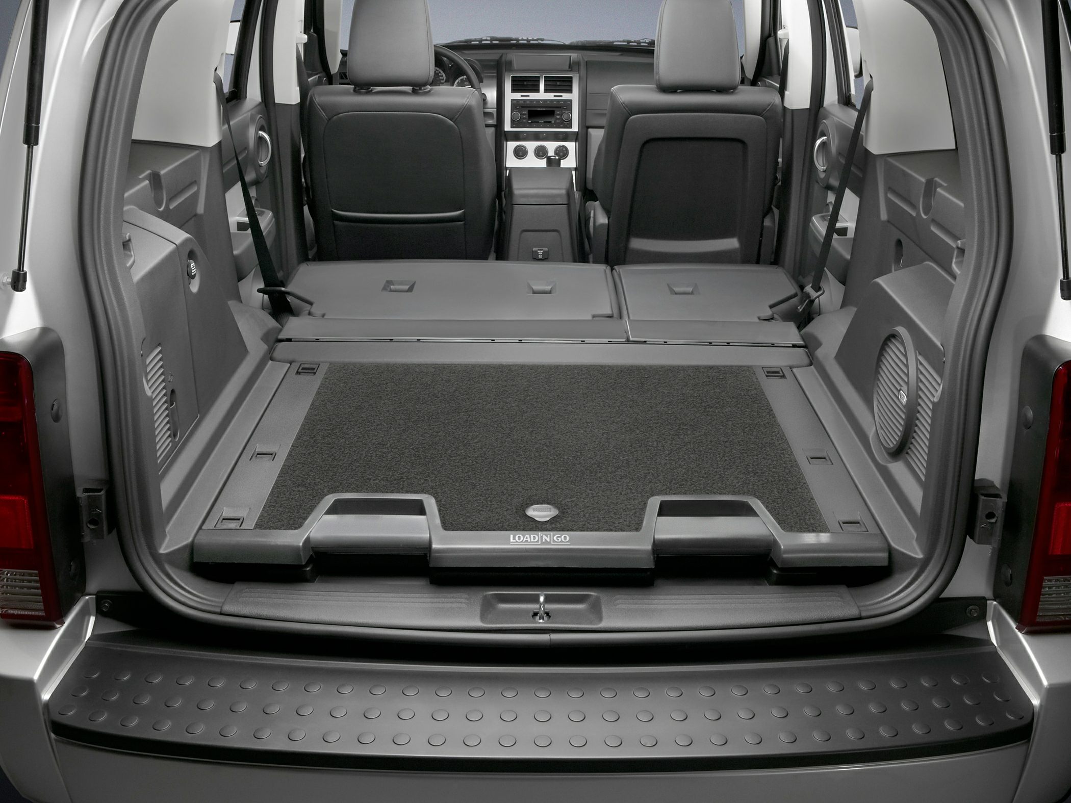 Rear cargo area with foldable seats and Load 'N Go storage system