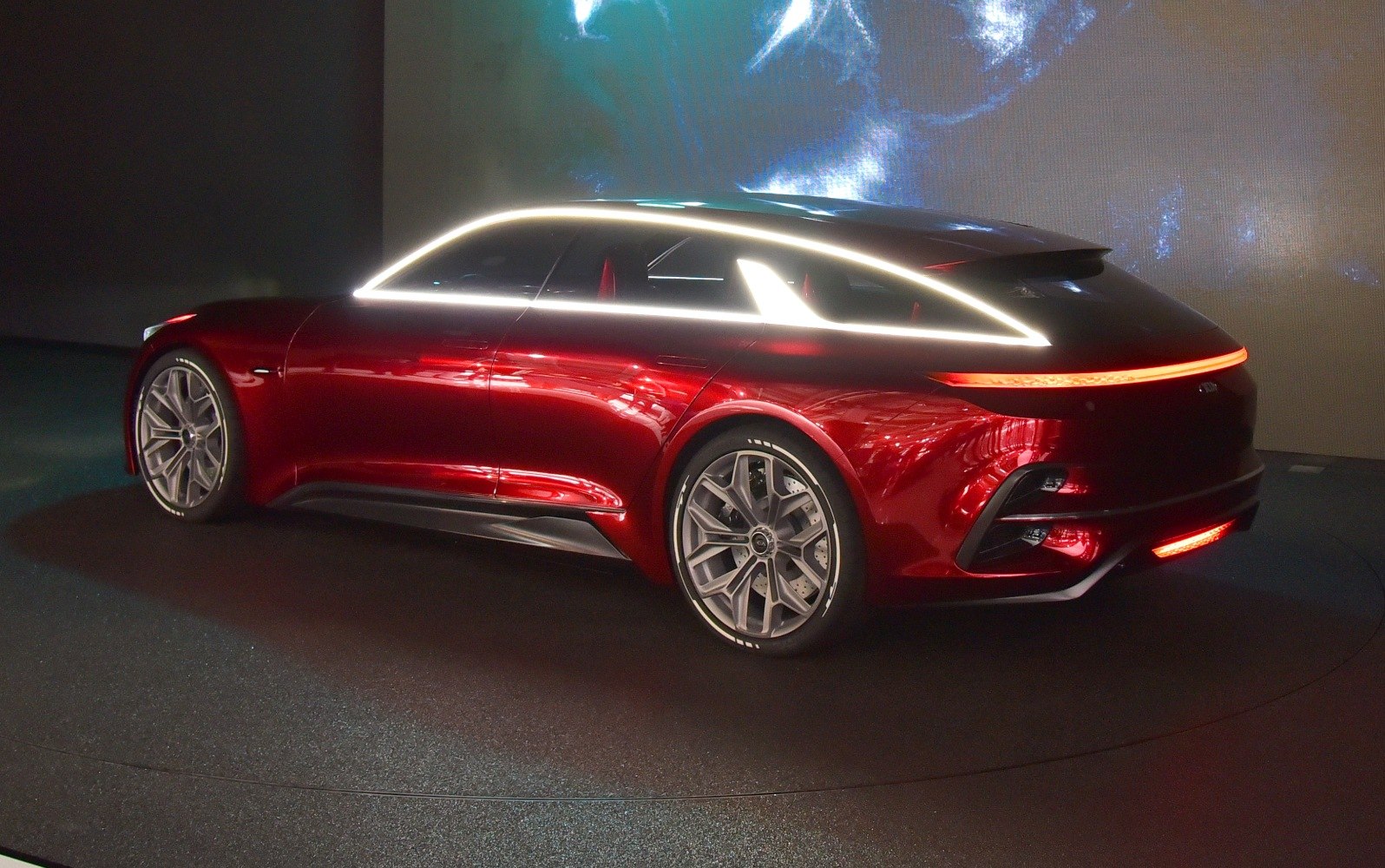 Sleek sport wagon with futuristic LED light accents and aerodynamic design.