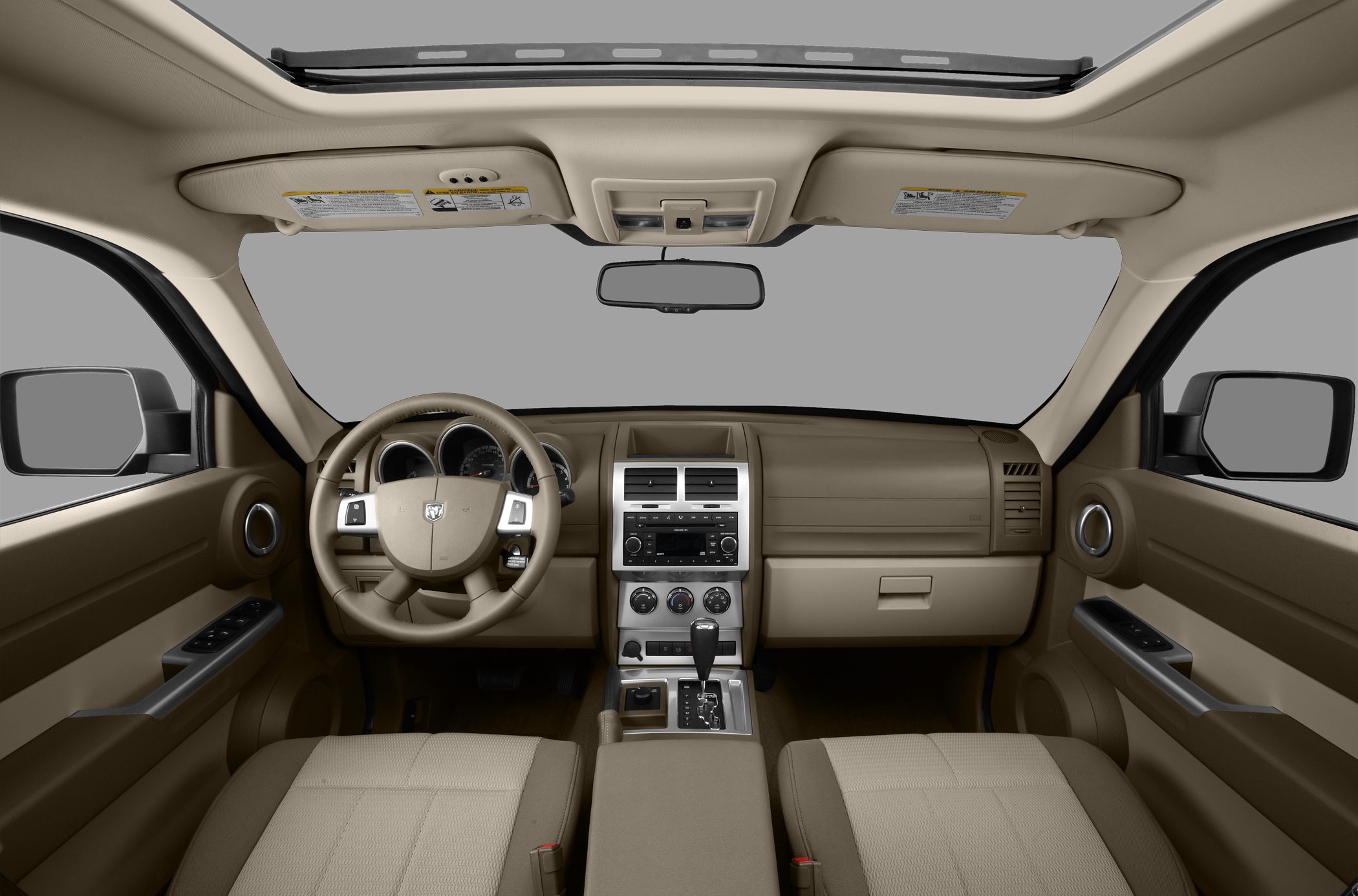 Interior dashboard and sunroof with beige upholstery