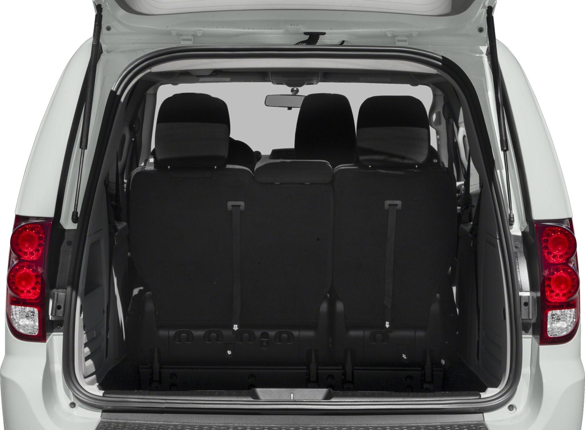 Rear interior view with folded seats and rear tail lights.