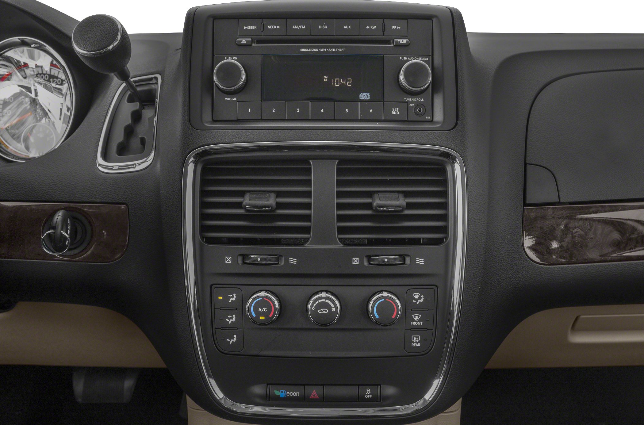 Dashboard control panel with audio system and climate control knobs