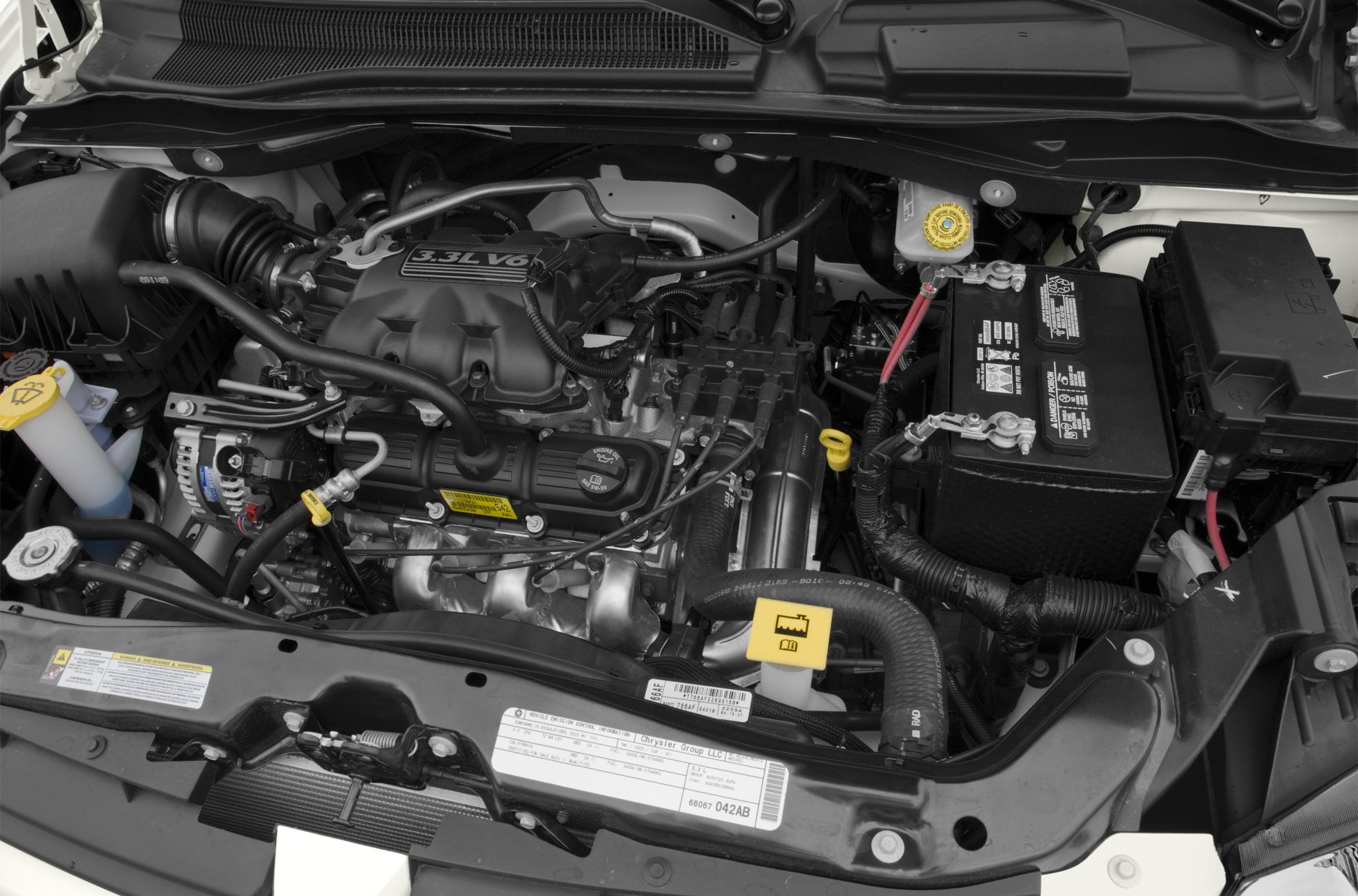 3.3L V6 engine with battery and coolant reservoir in engine bay