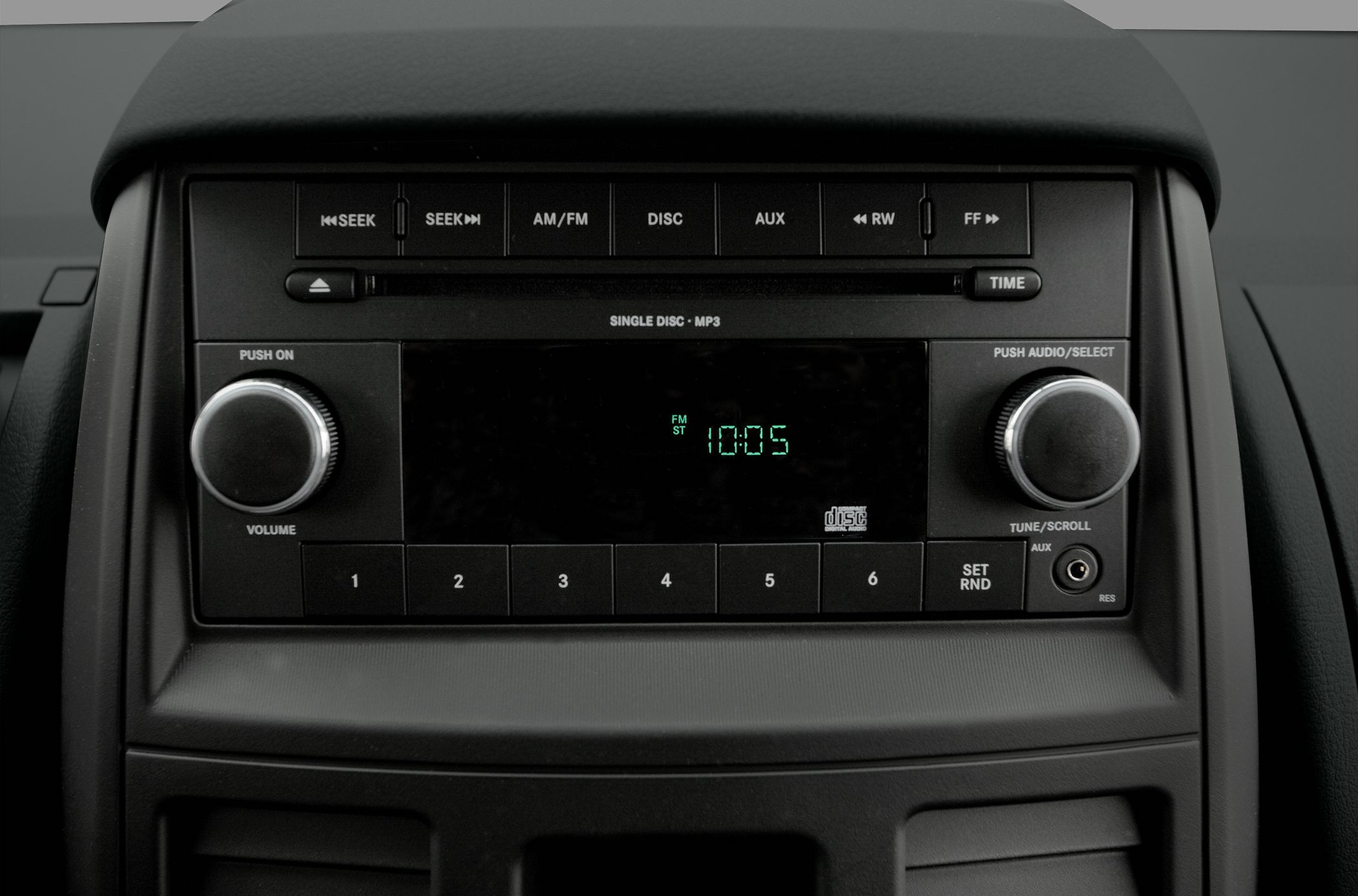 Car audio system with CD player, radio, and auxiliary input, push volume and tune knobs.