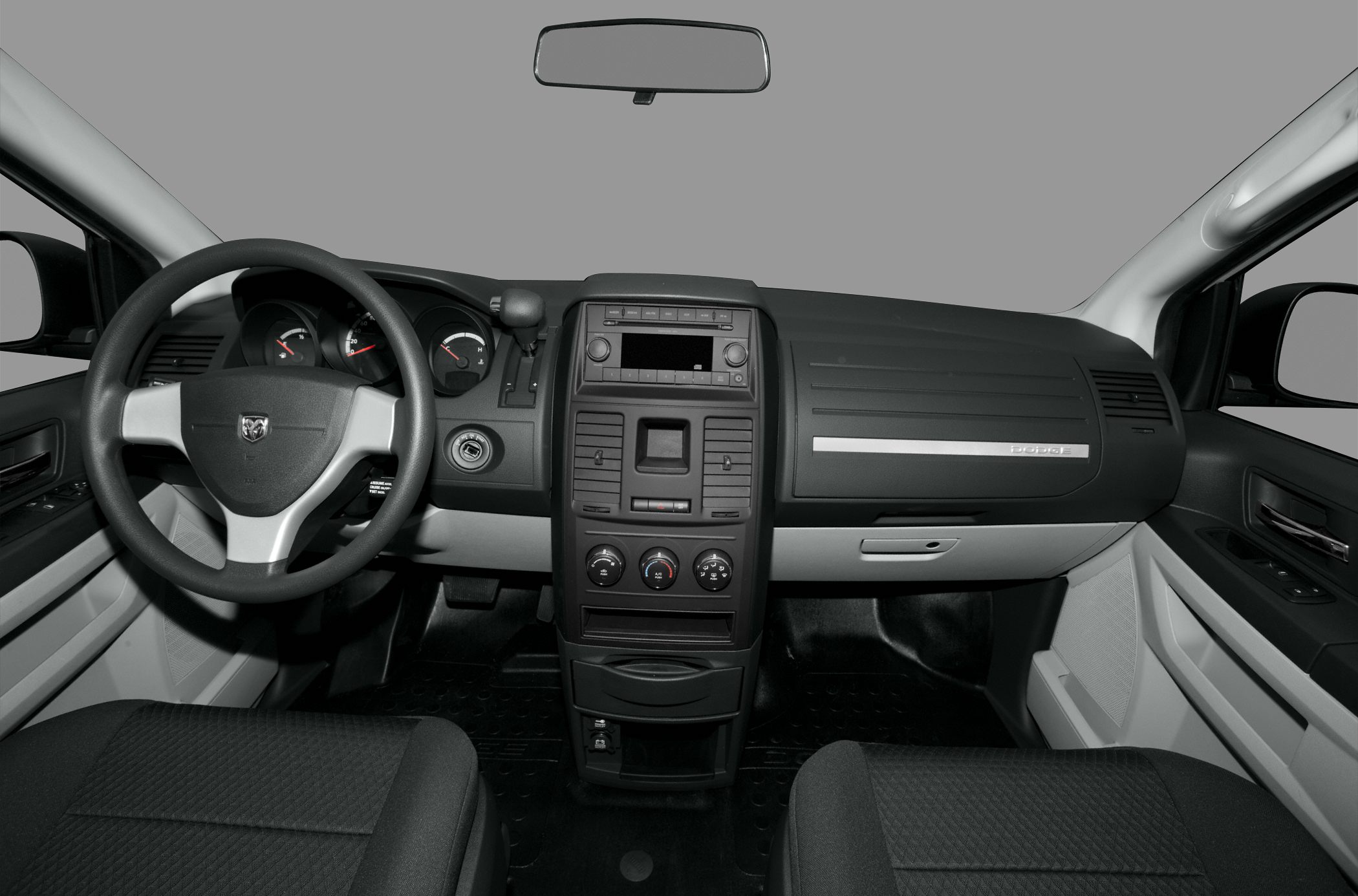 Dashboard layout with steering wheel and central control panel