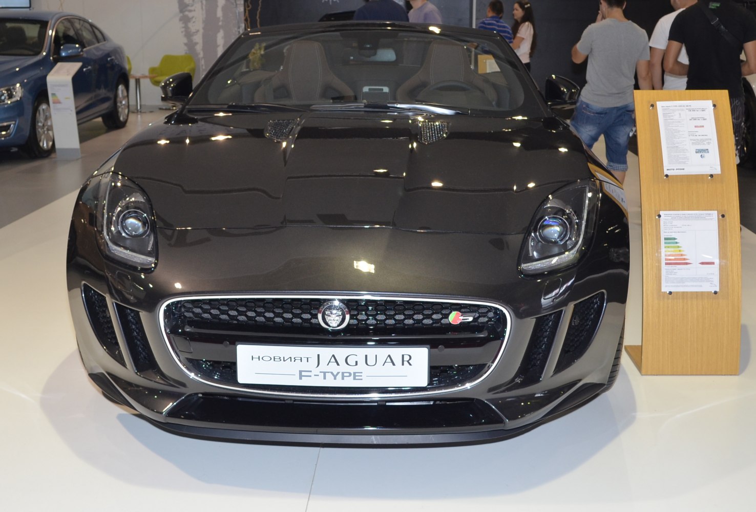 Front view with distinctive headlights and sporty grille of a convertible sports vehicle