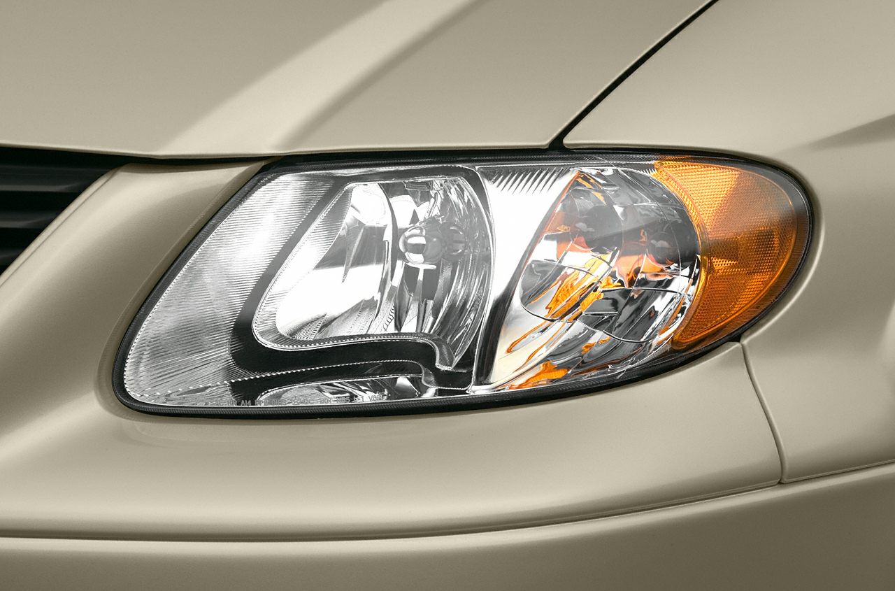 Close-up of a vehicle's headlight and amber turn signal light