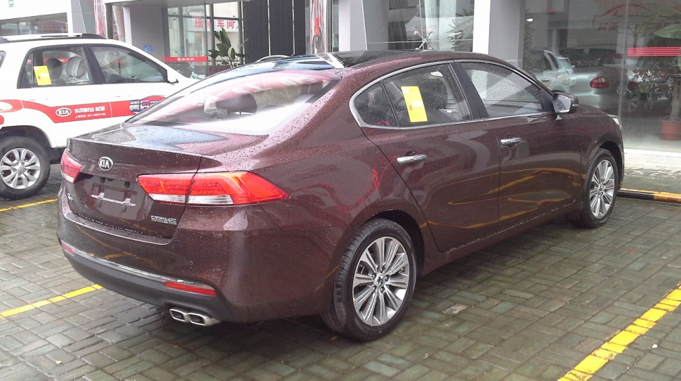 Rear and side view with dual exhaust and alloy wheels