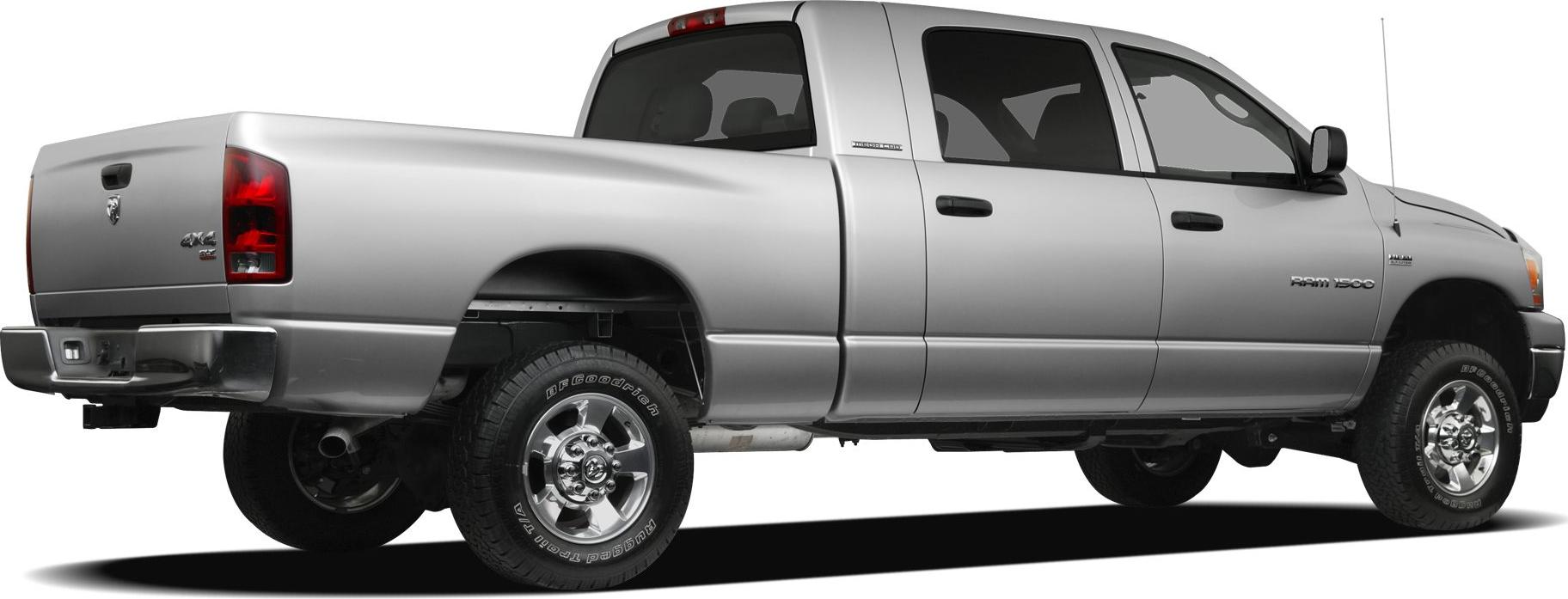 Silver full-size extended cab pickup truck rear side view