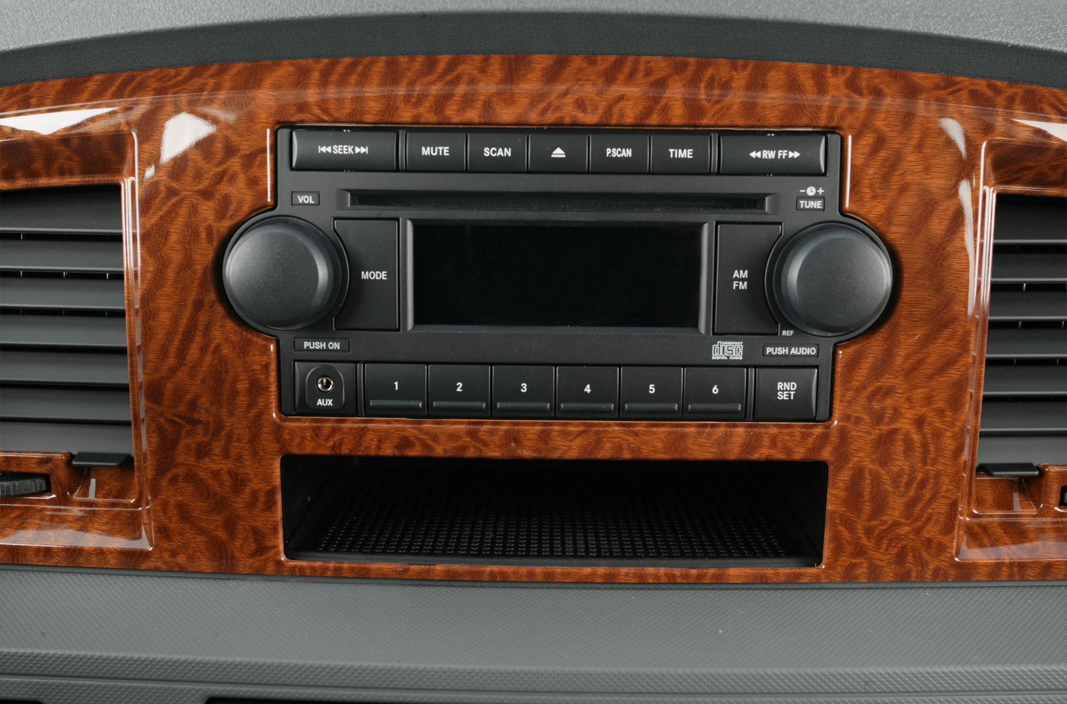 Classic woodgrain dashboard with stereo system and control buttons