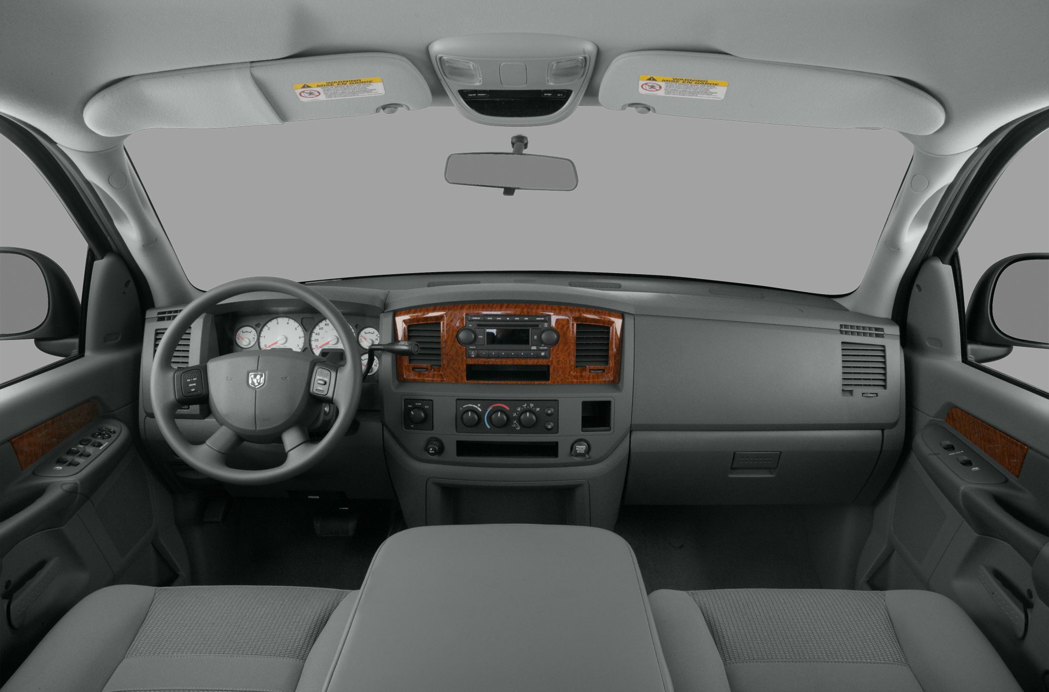 Pickup truck interior dashboard with steering wheel and wood trim accents