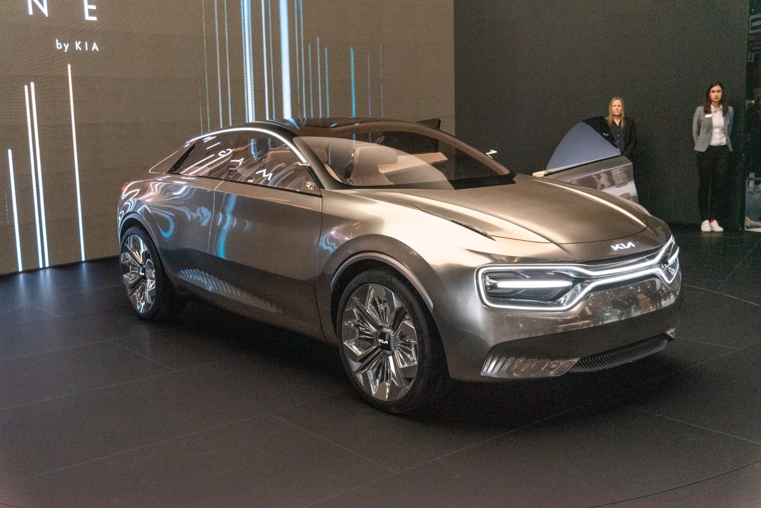 Futuristic crossover SUV with LED lights and chrome wheels.