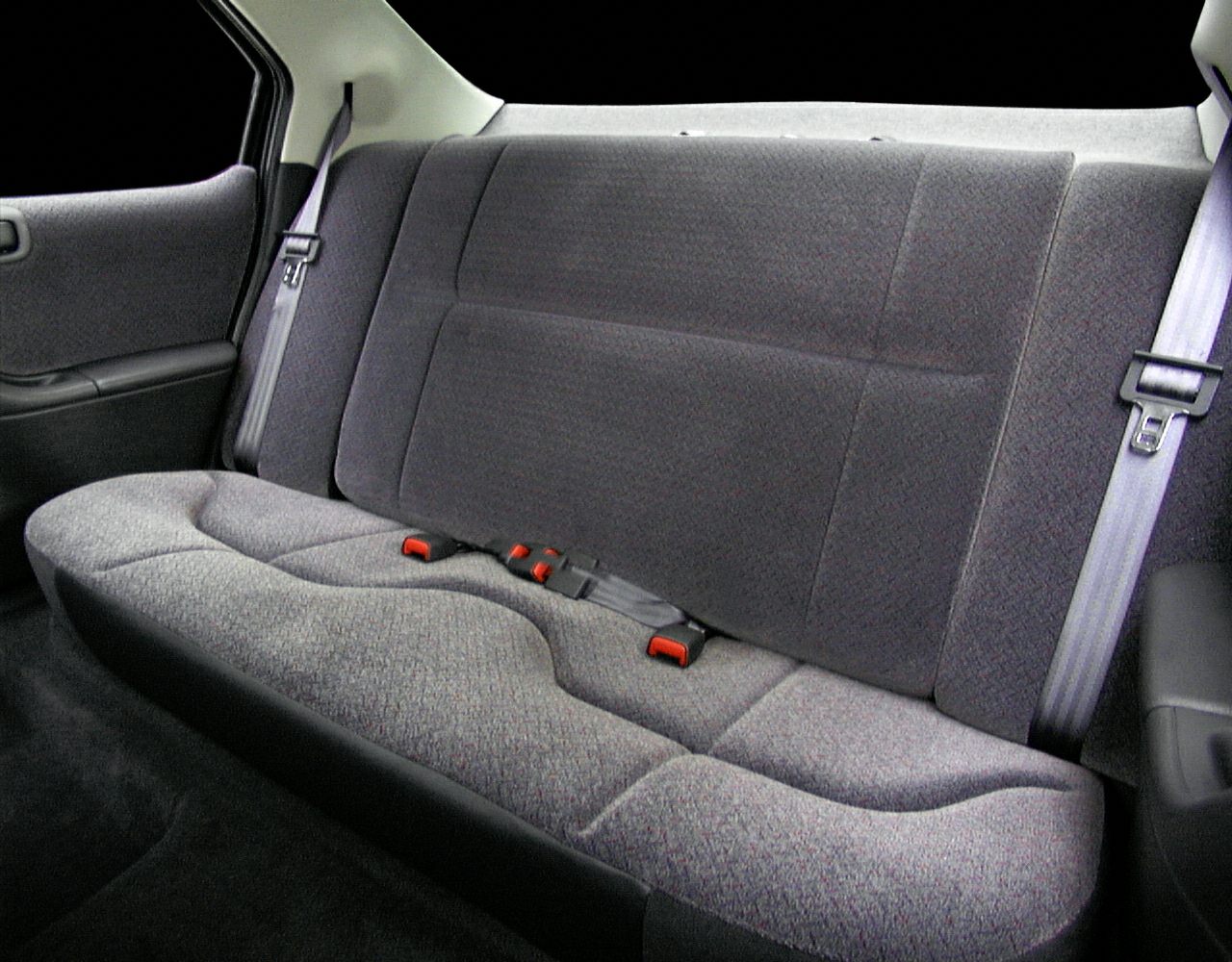 Rear fabric bench seat with safety belts in car interior