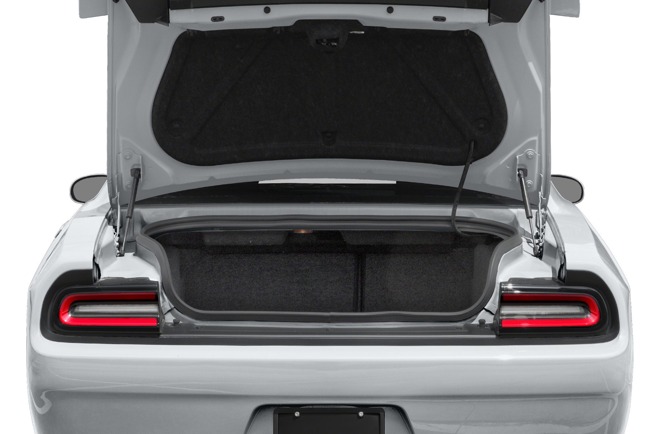 Open rear trunk with illuminated tail lights on modern muscle car