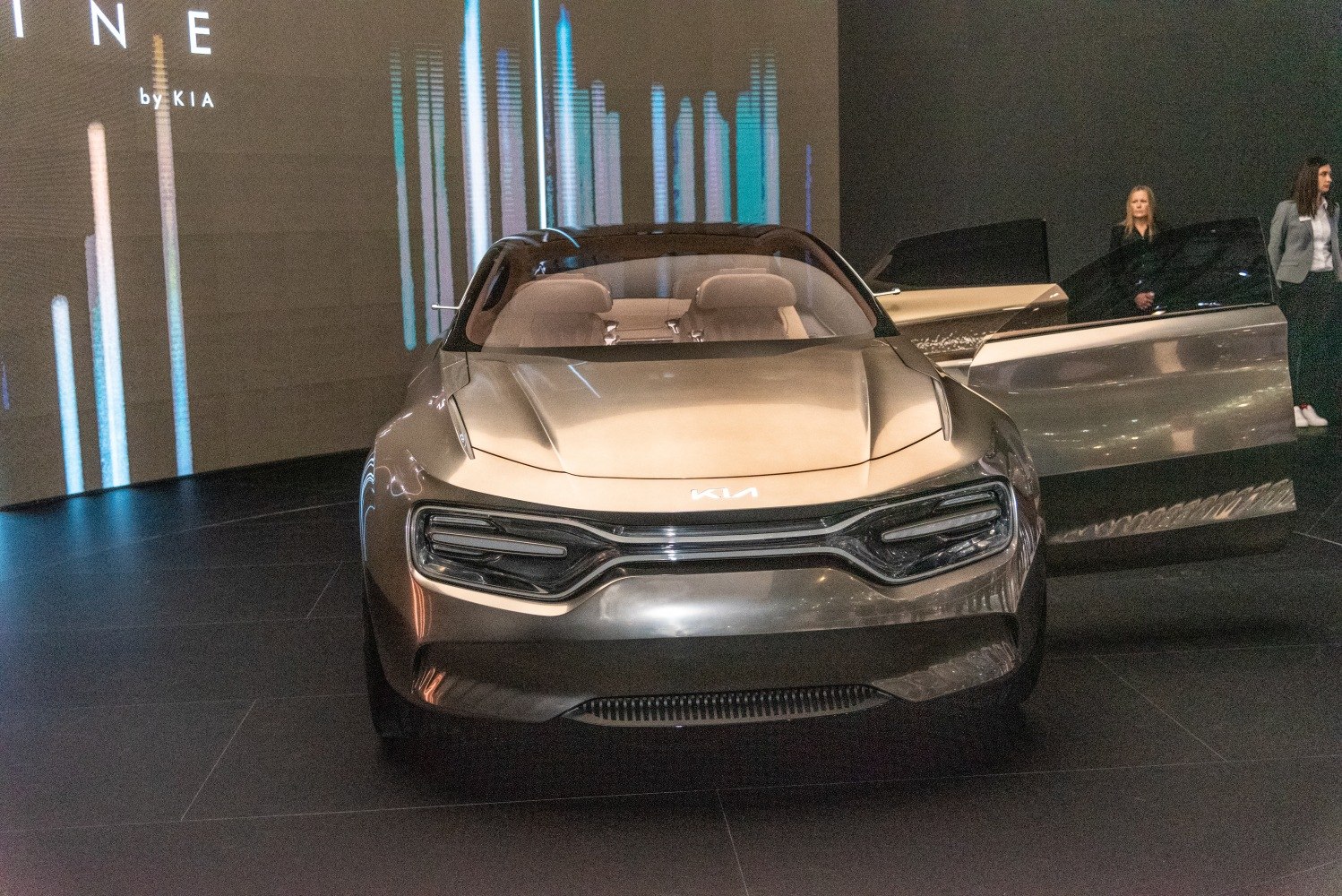 Futuristic front end with illuminated grille and sculpted hood