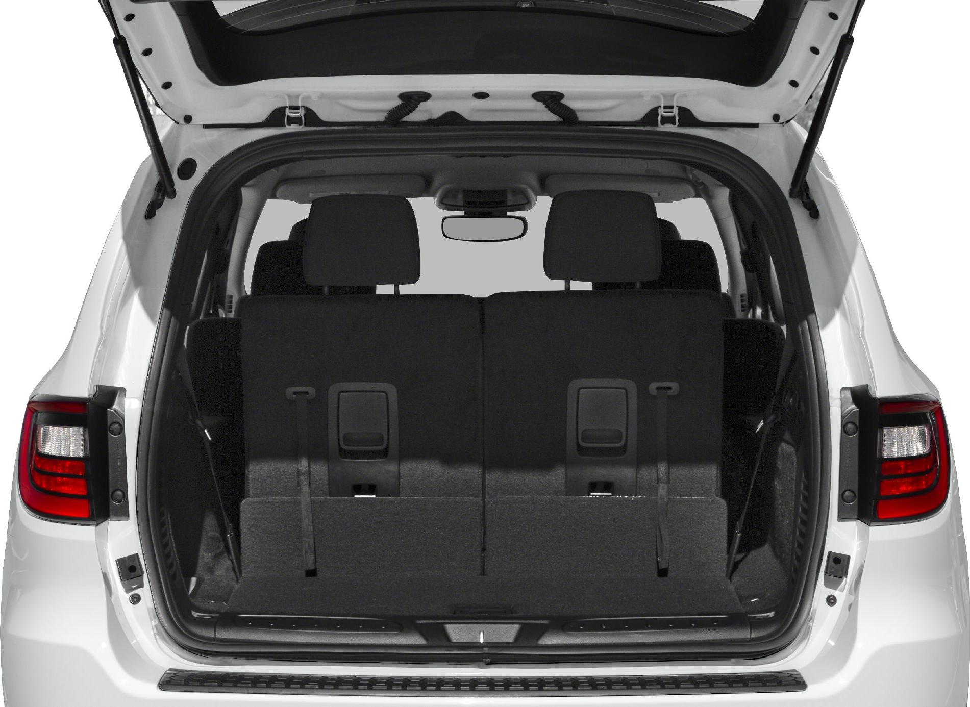 Rear cargo space with foldable seats and hatch open.