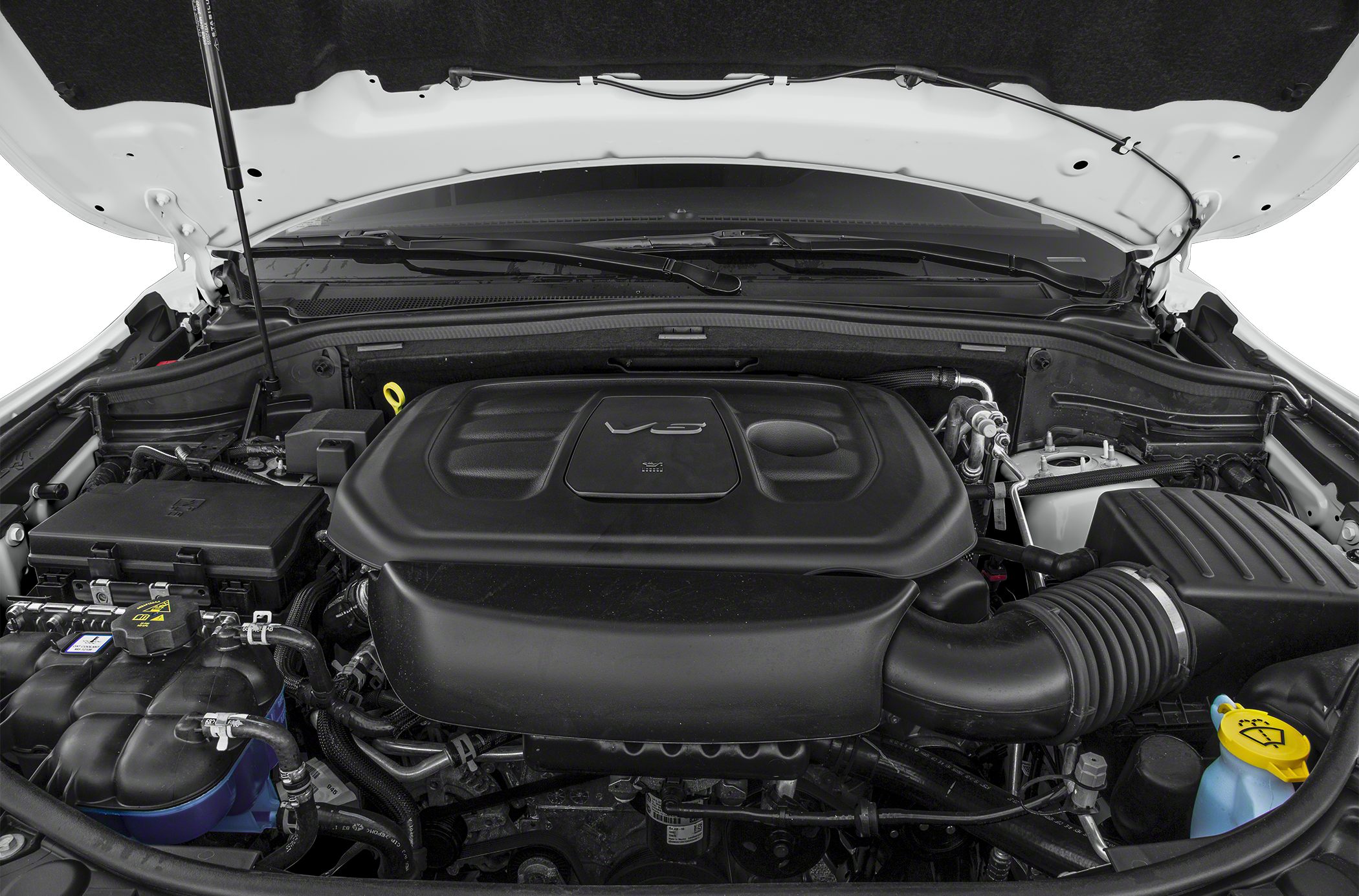 V6 engine bay with prominent engine cover and intake tubing