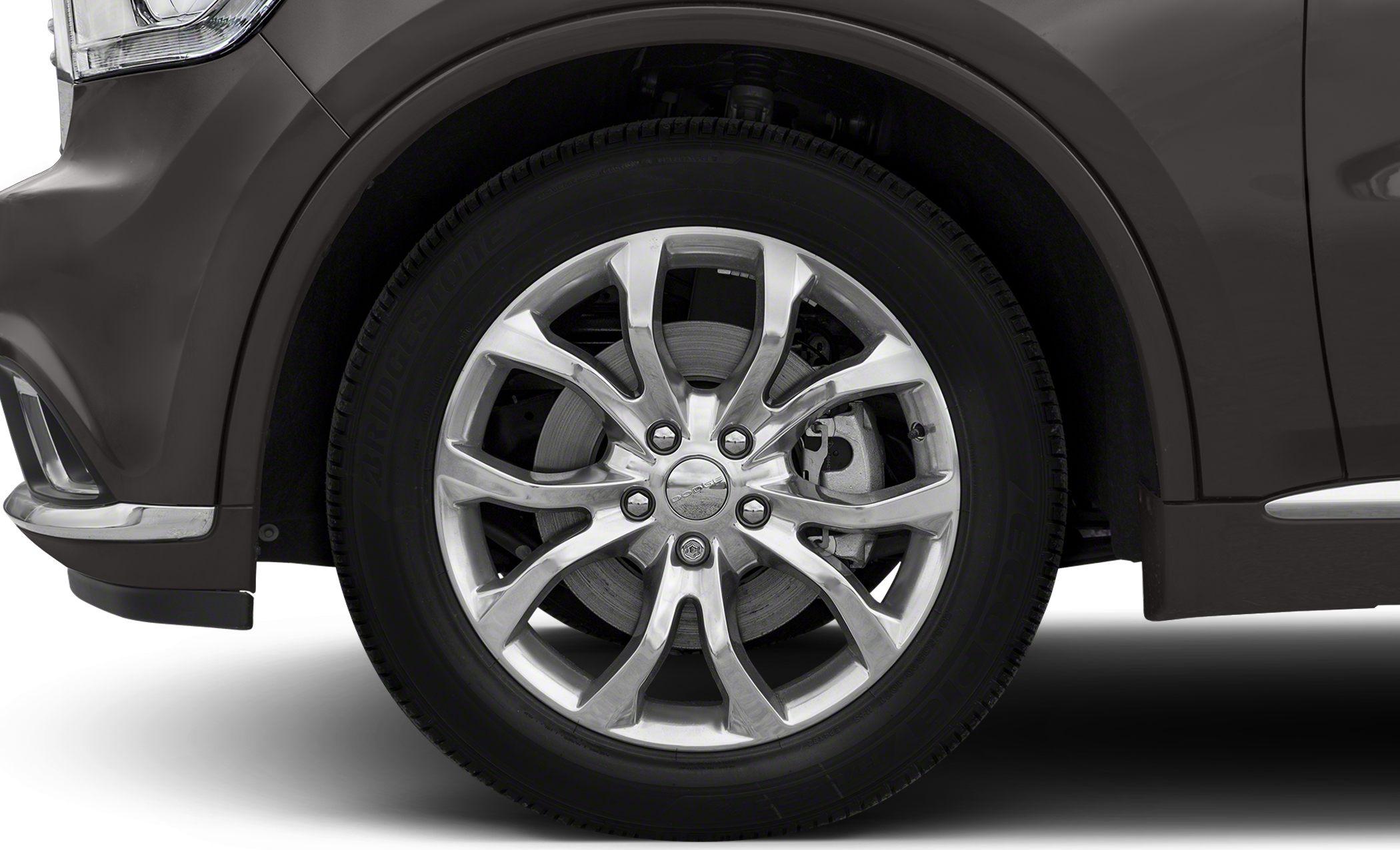 Close-up of chrome alloy wheel and tire with visible brake caliper