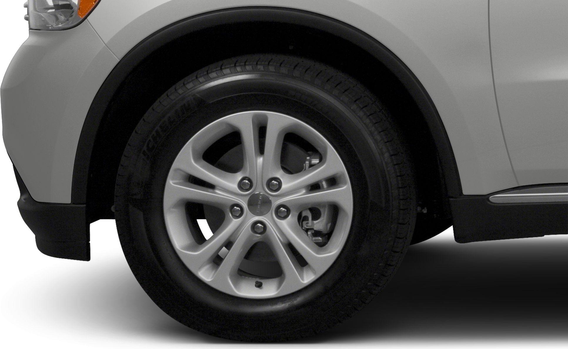 Alloy wheel and tire with visible brake caliper and rim design
