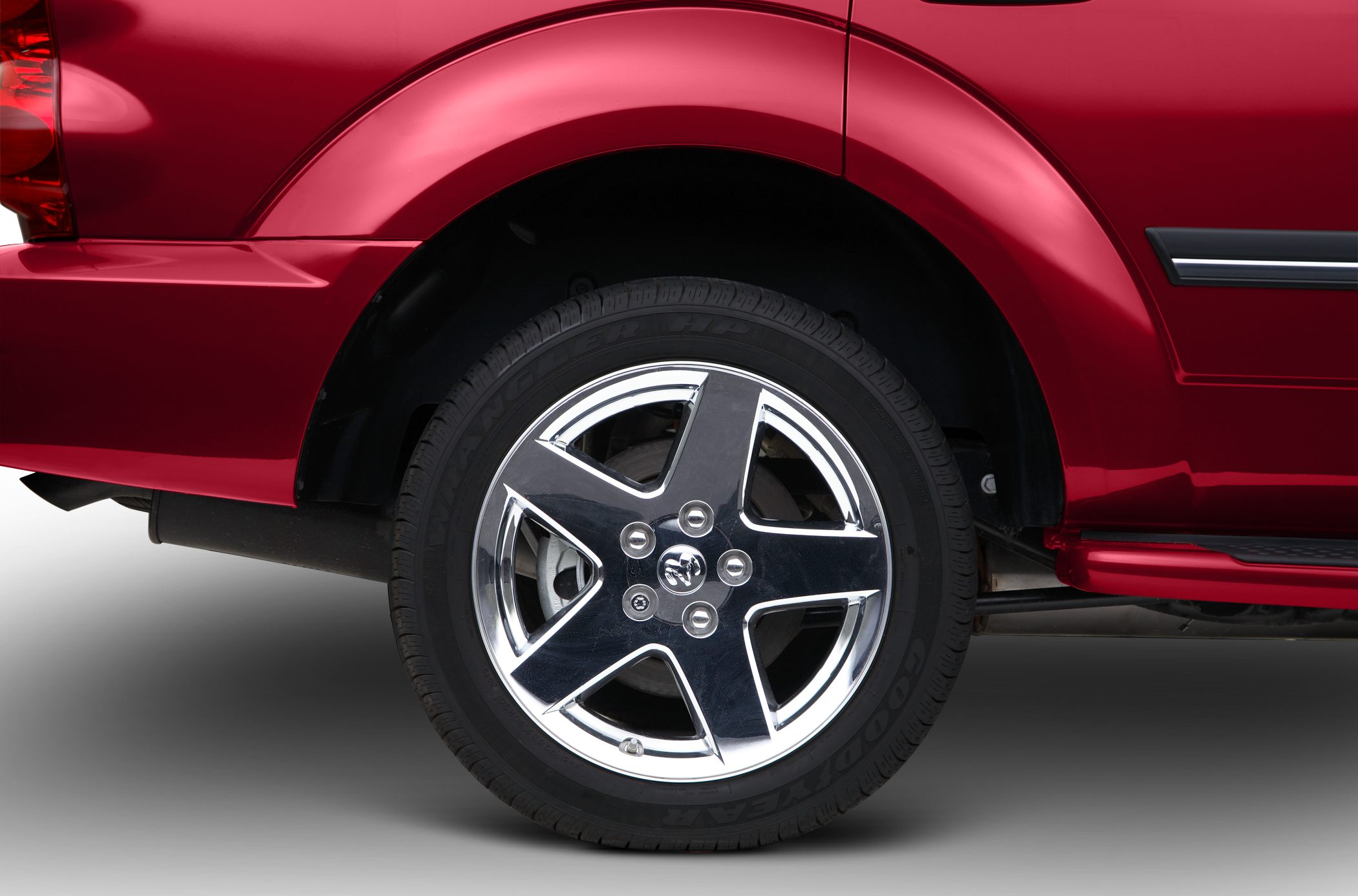 Five-spoke alloy rim with Goodyear Wrangler HP tire on rear wheel
