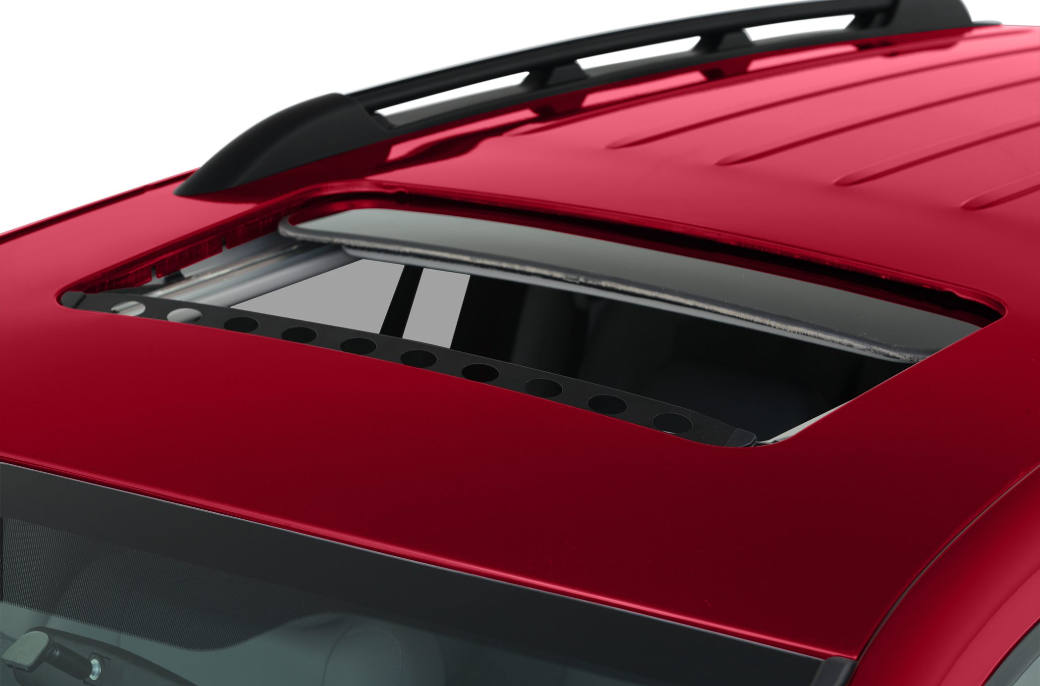 Sunroof and roof rails close-up on red vehicle roof