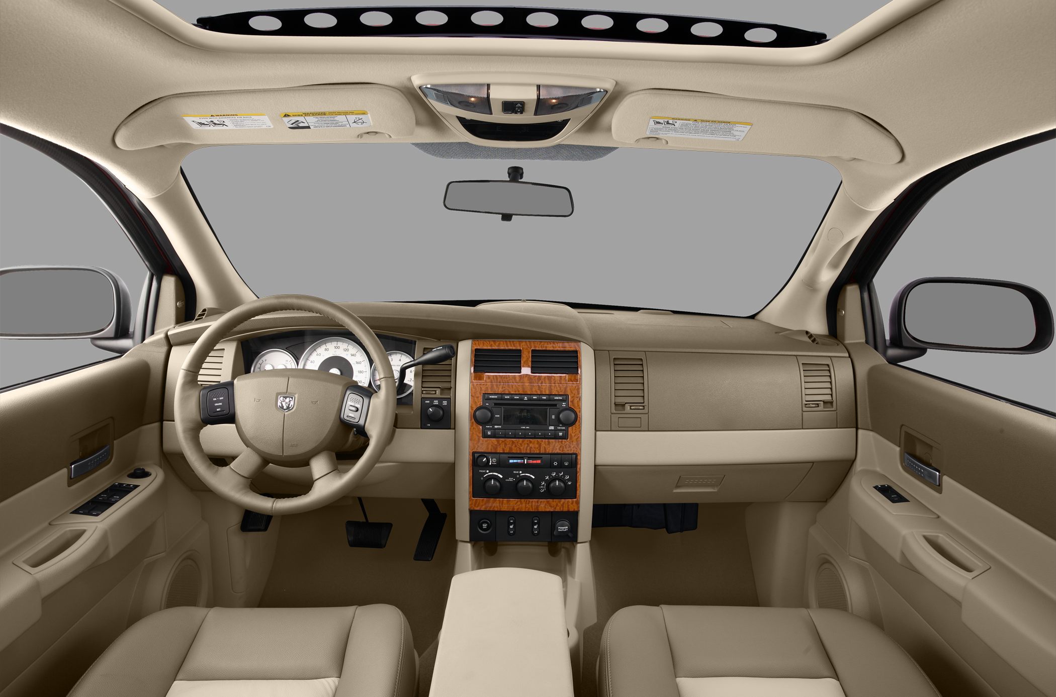 Beige interior with wood trim center console and panoramic sunroof