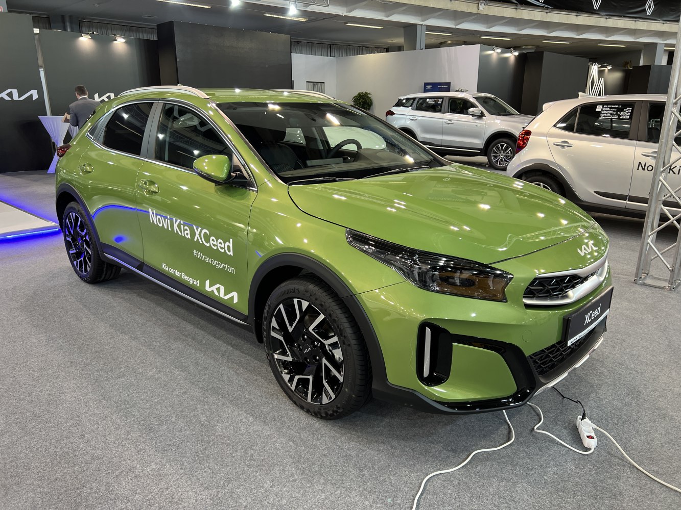 Facelifted car front and side view with LED headlights and alloy wheels