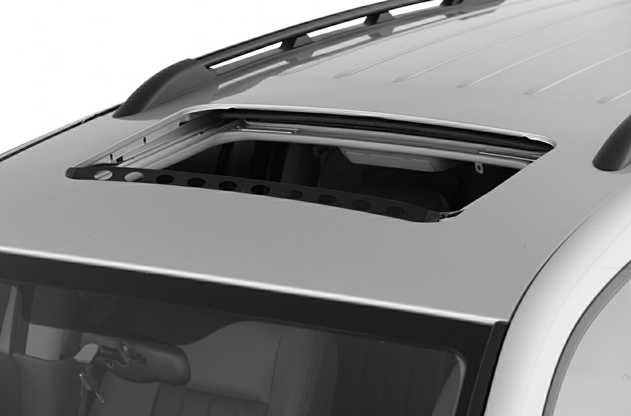 Open sunroof and roof rails on SUV roof