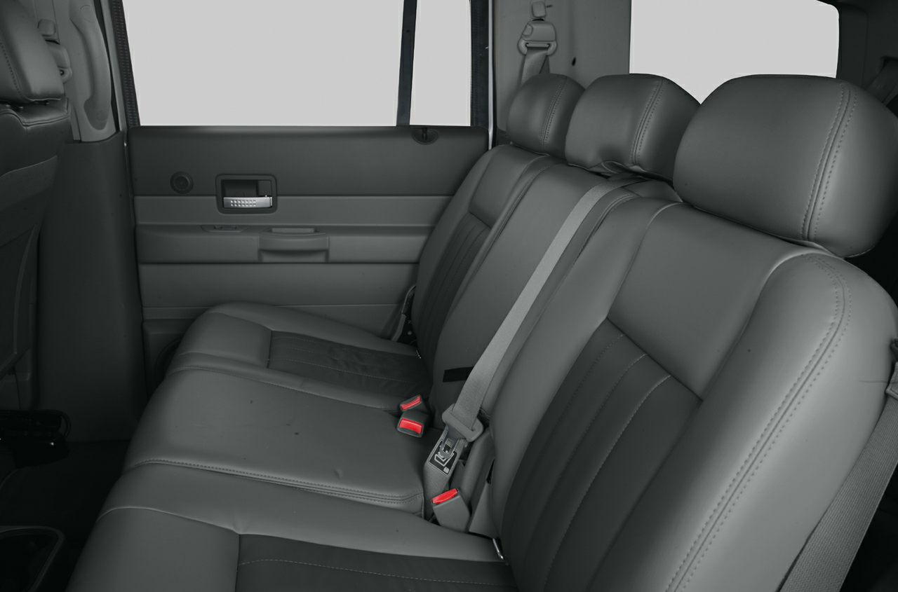 Leather rear seats with seat belts and door panel in SUV interior
