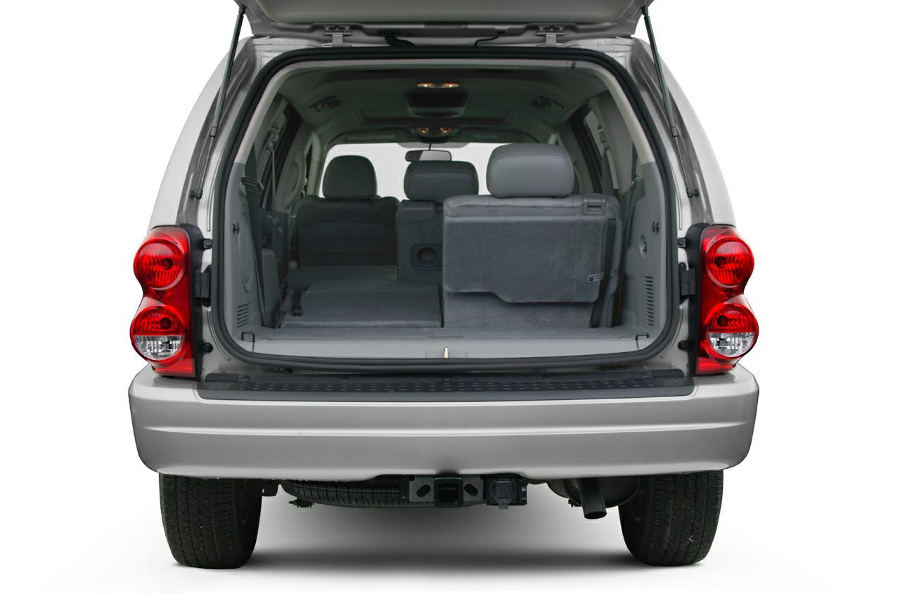 Spacious rear cargo area with foldable seats and illuminated ceiling lights