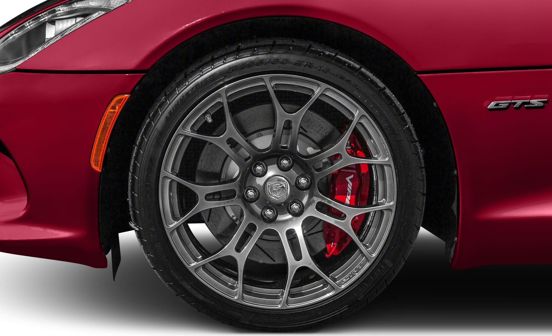 Multi-spoke alloy wheel with red brake caliper and ventilated disc brake