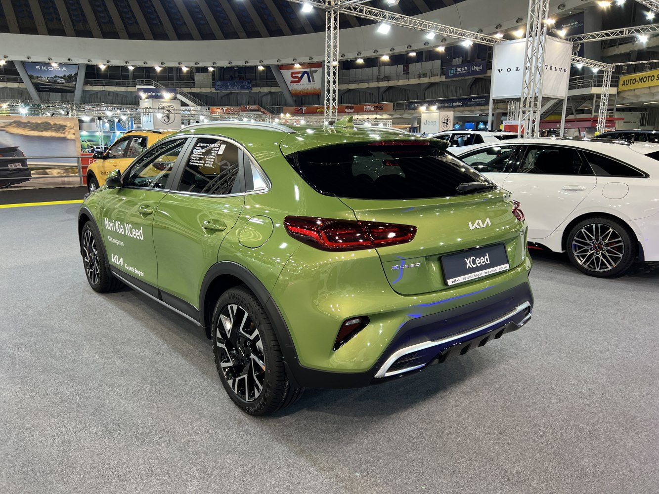 Rear and side view of green crossover with alloy wheels and LED taillights