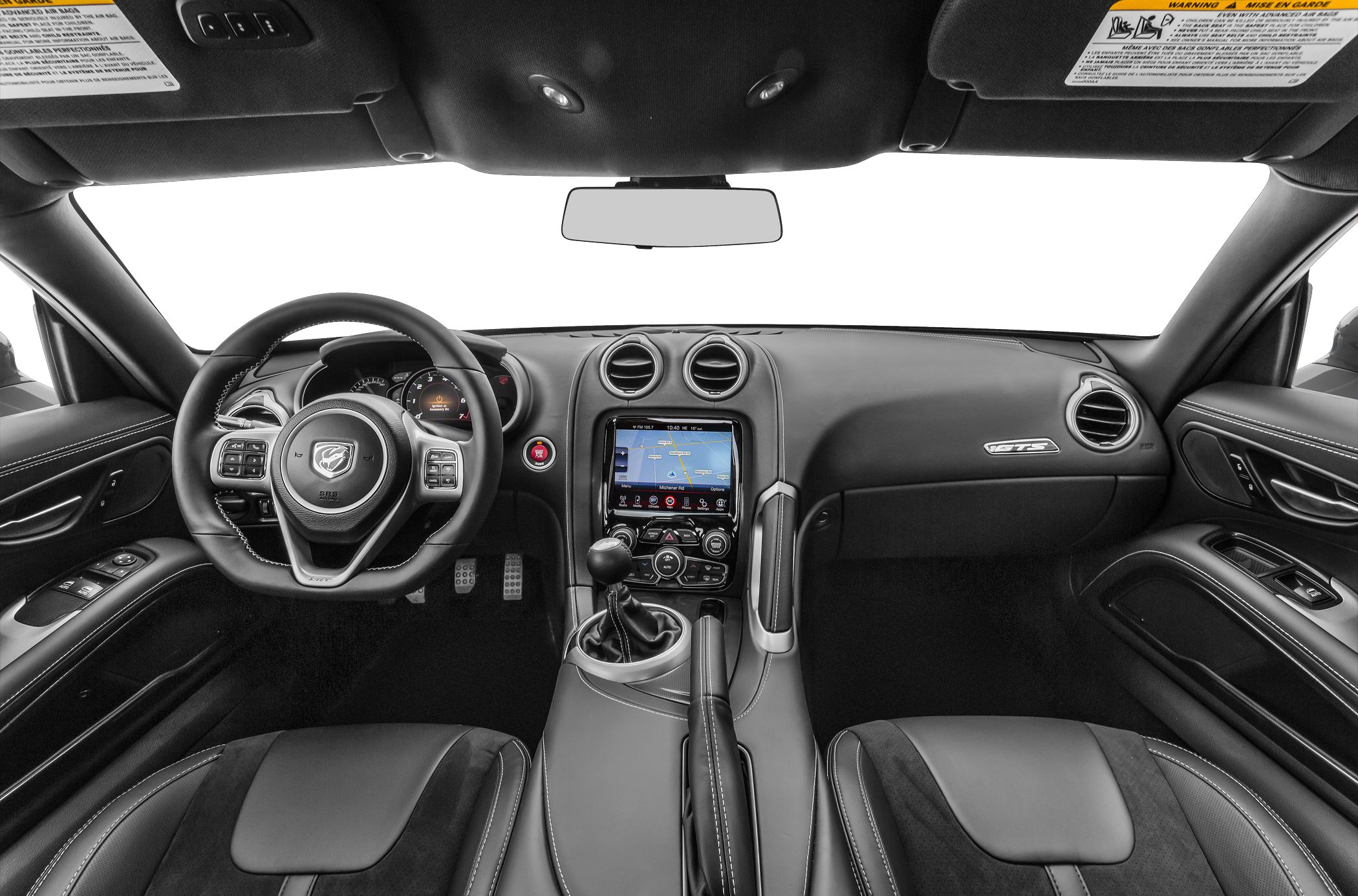 Modern sports car interior with touchscreen, manual gear stick, and logo-emblazoned steering wheel