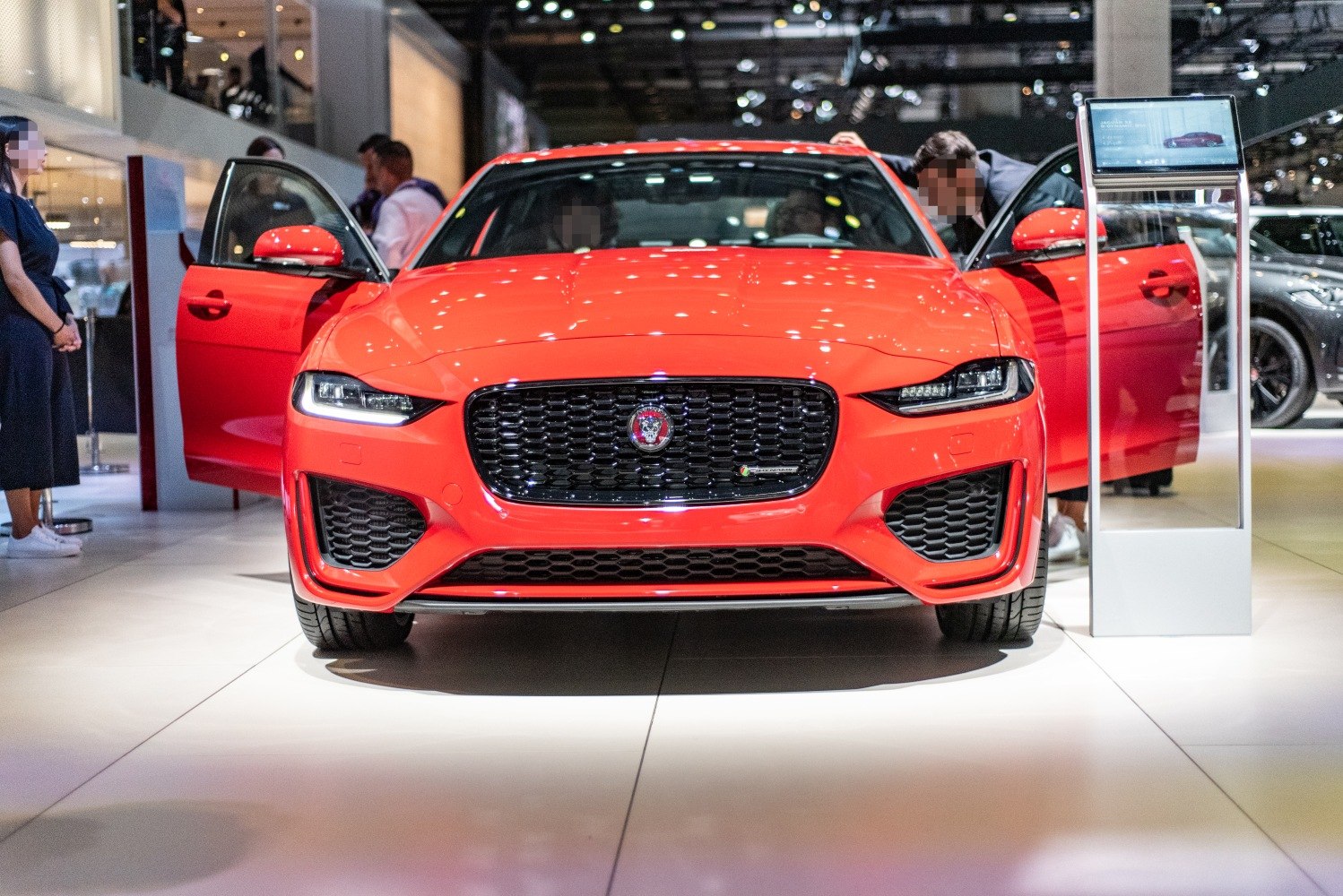 Front view with distinctive grille, LED headlights, and open doors
