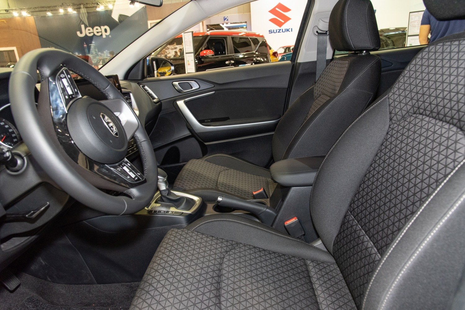 Patterned front seats and central console with steering wheel controls