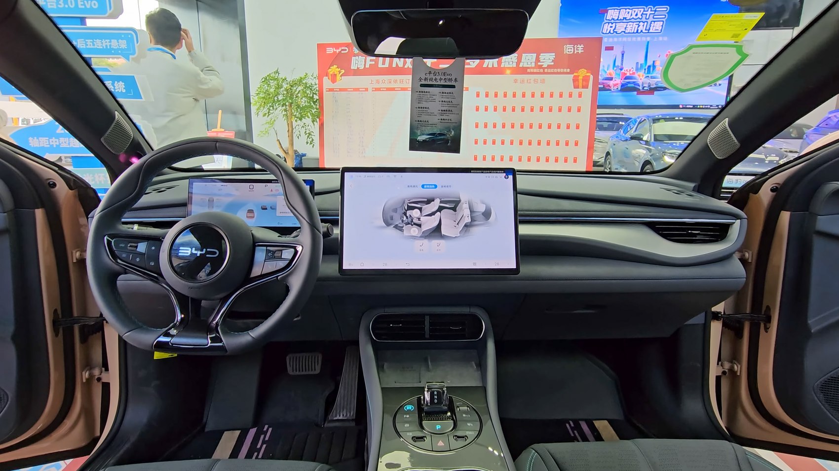 Digital dashboard and large central touchscreen with steering wheel controls