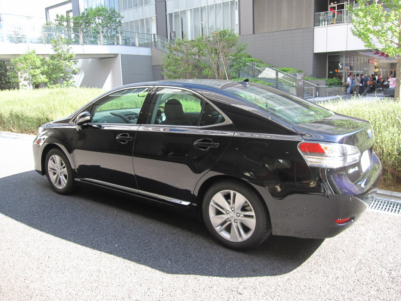 Rear side profile of hybrid luxury sedan with alloy wheels