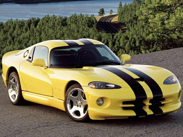 Yellow sports coupe with black racing stripes and aerodynamic design