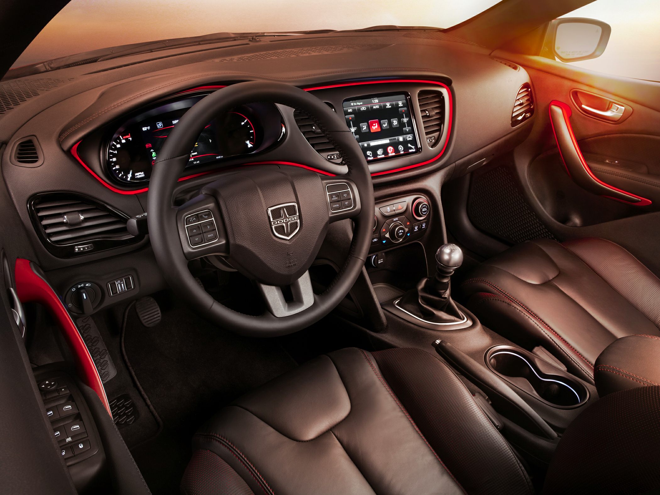 Manual transmission, touchscreen infotainment, leather seats with red accents