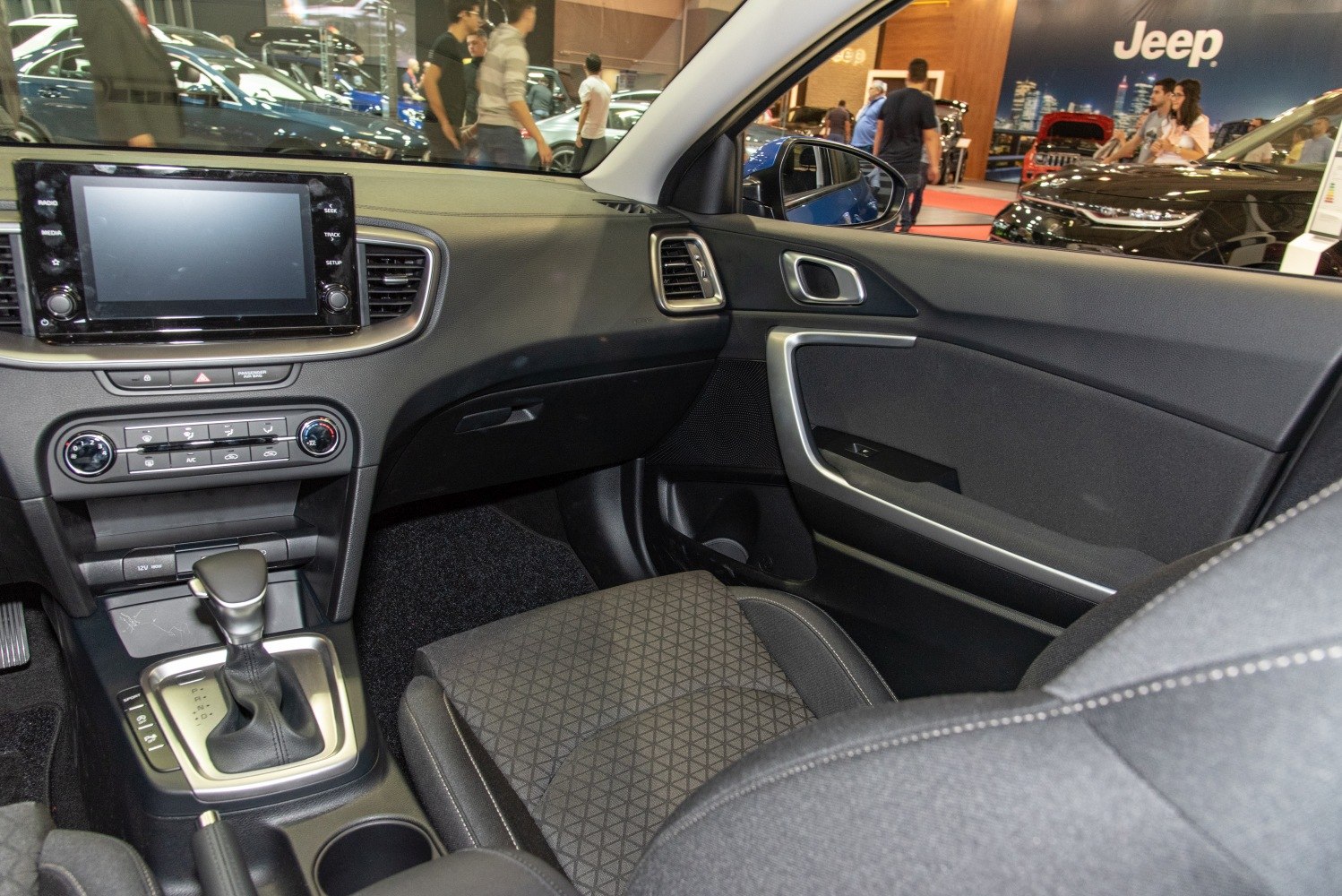 Modern car dashboard with touchscreen infotainment and gear shift console