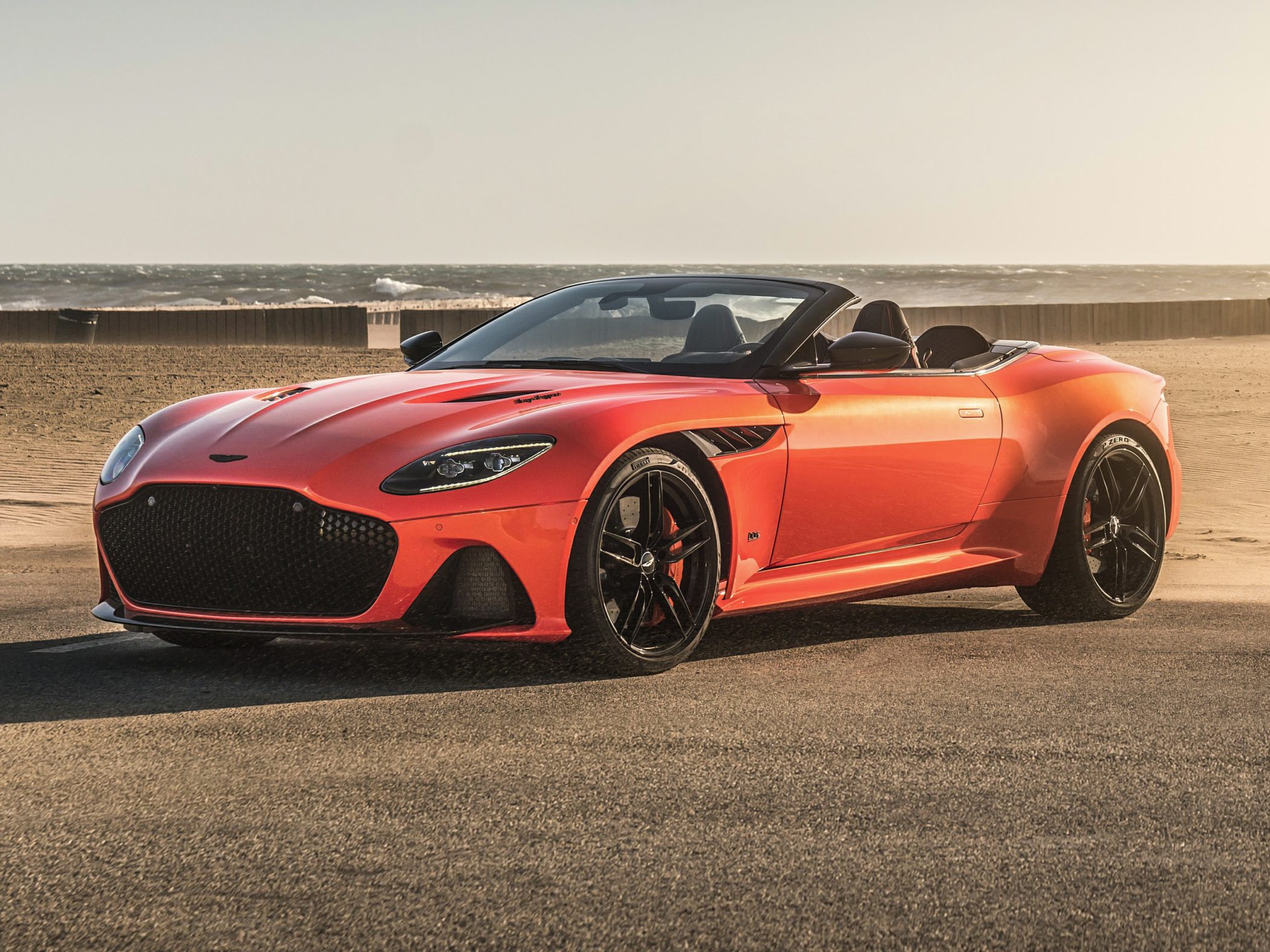 Convertible sports car with aggressive front grille and sleek aerodynamic design