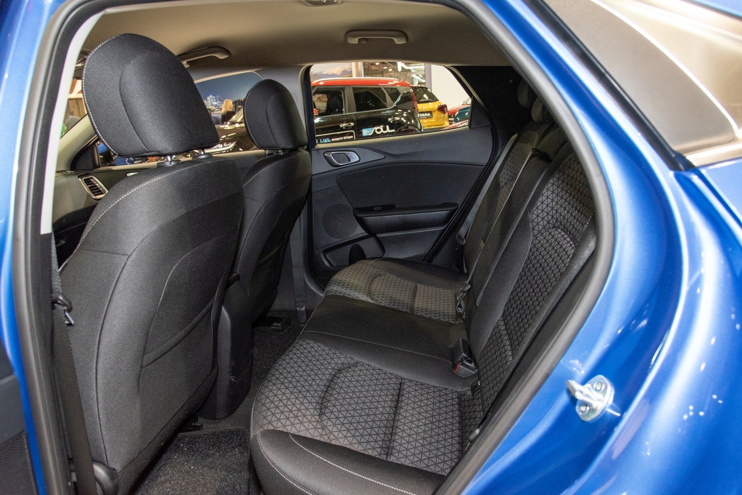 Rear fabric seating with patterned upholstery and headrests