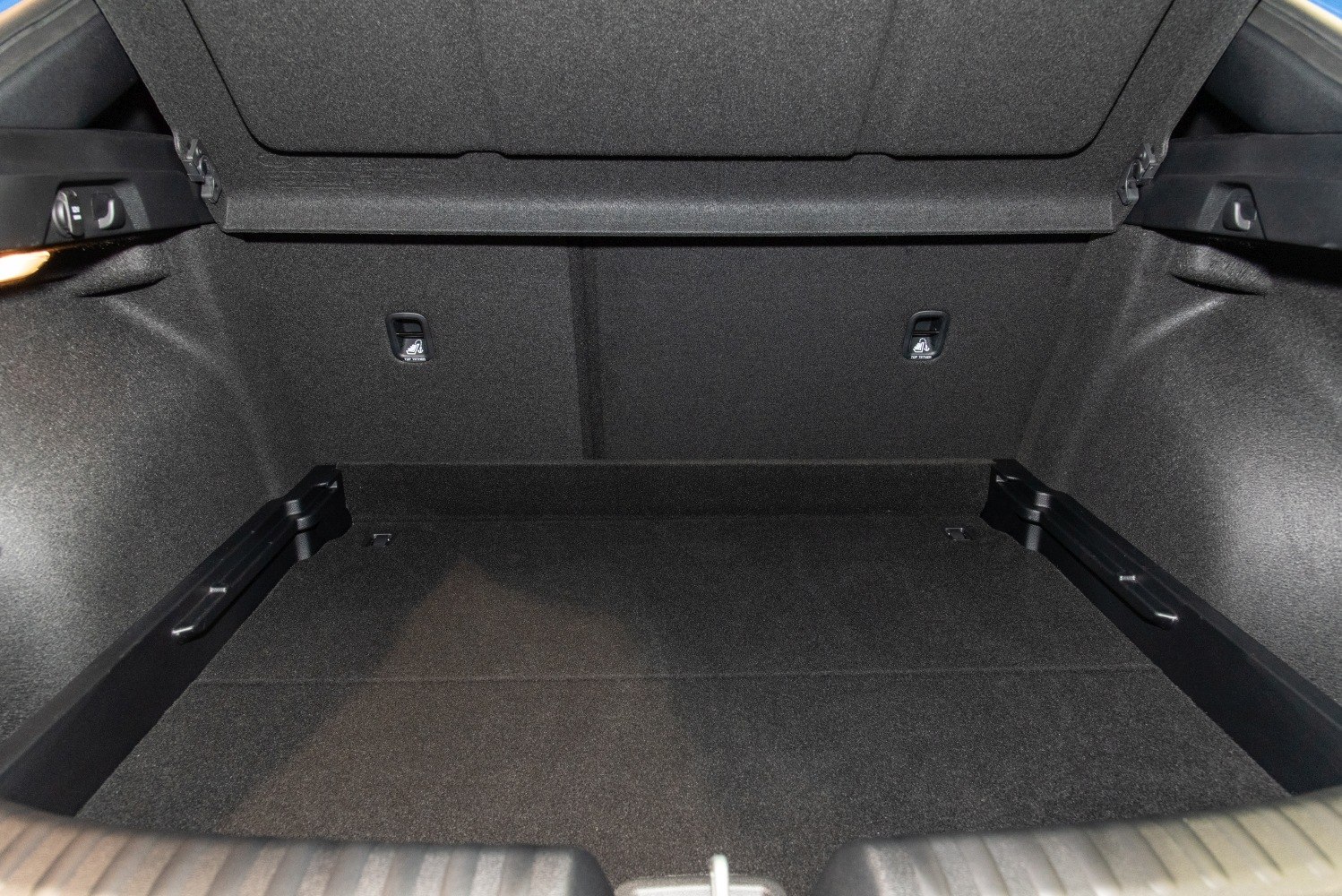 Spacious rear trunk interior with fold-down seat release handles
