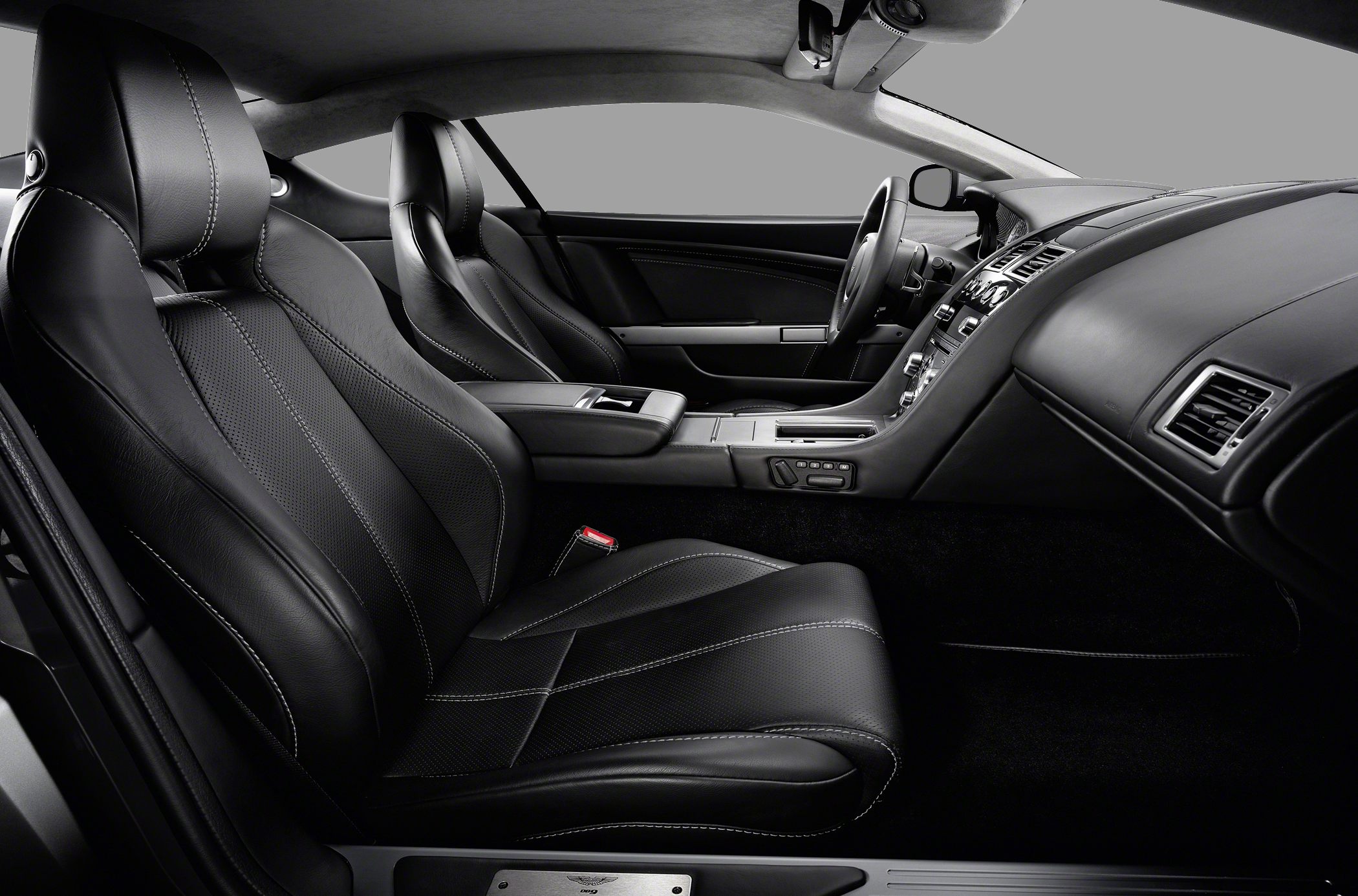 Black leather sport seats with white stitching and premium dashboard