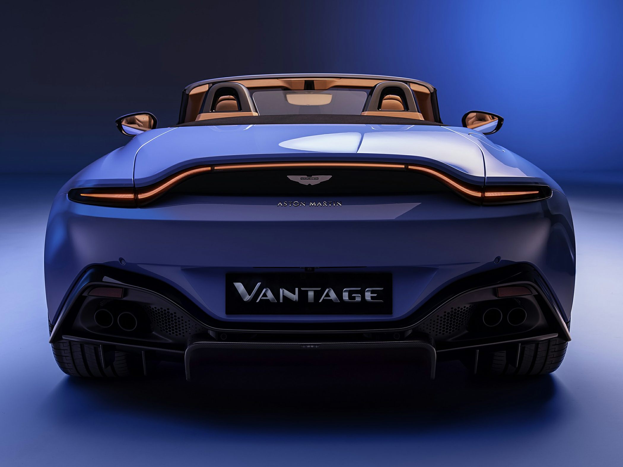 Distinctive rear design with continuous taillight and quad exhausts.