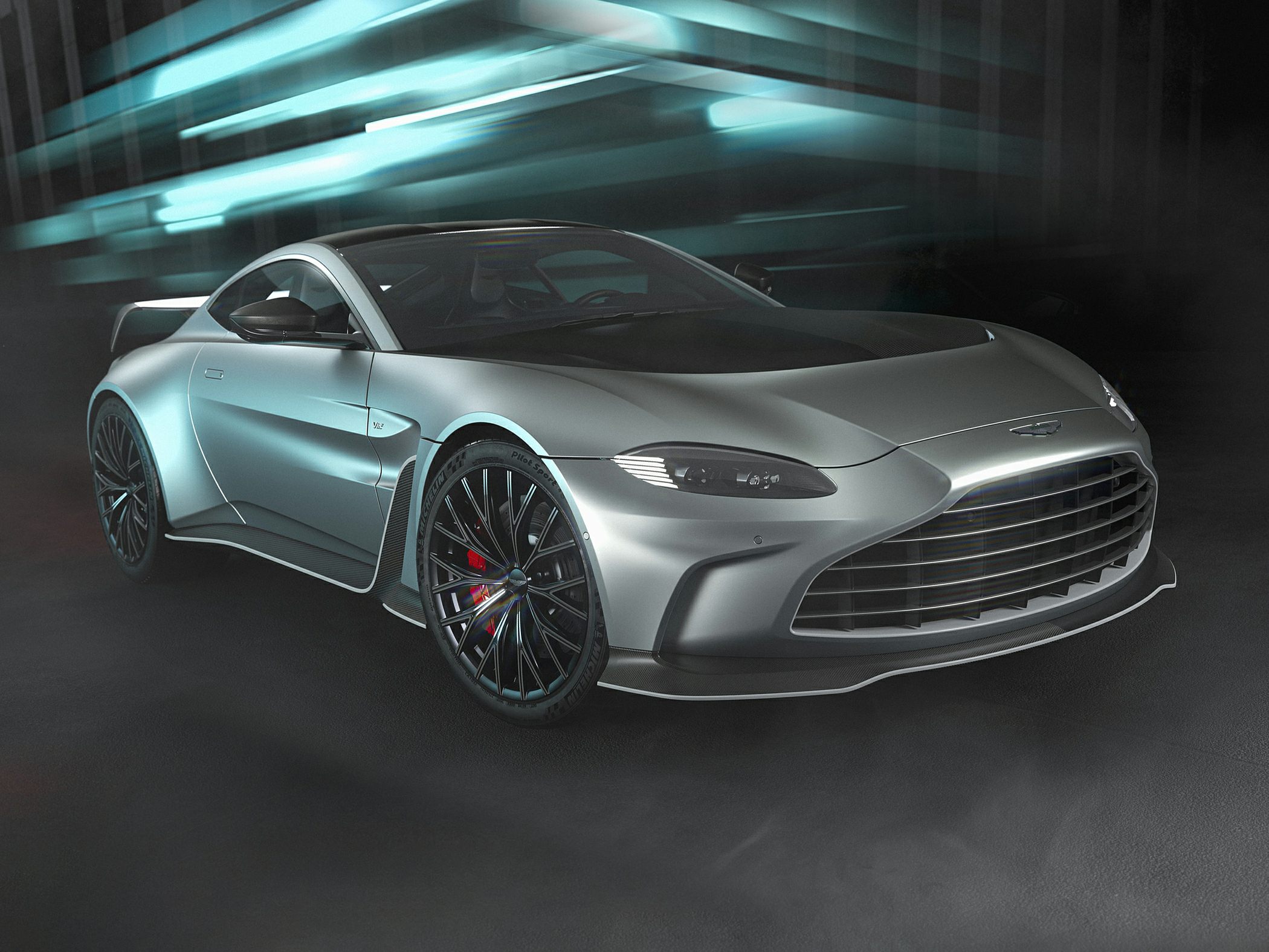 Front view of a sleek coupe with wide grille and aerodynamic splitter