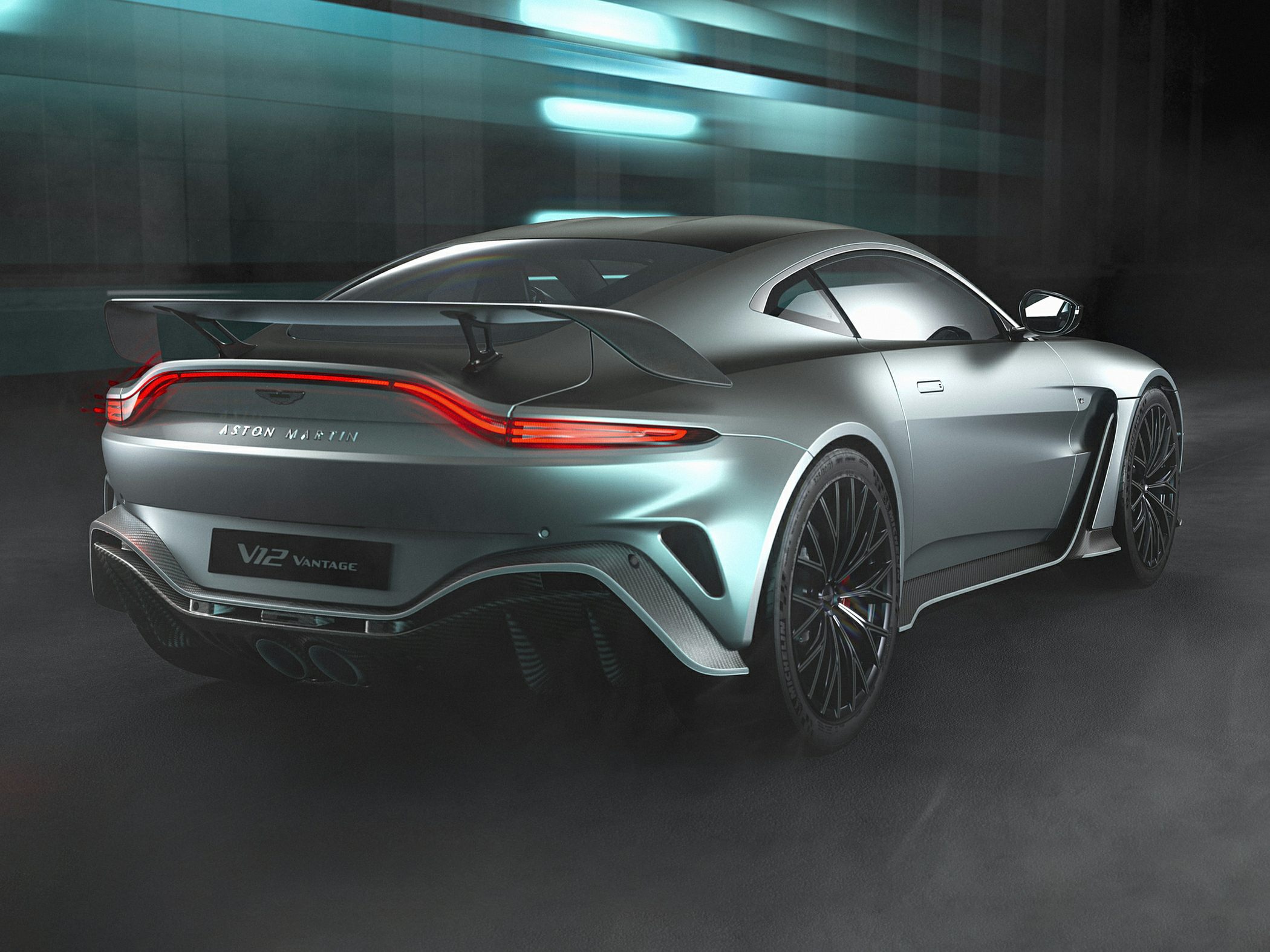 Sleek rear view with aerodynamic wing and distinctive tail lights