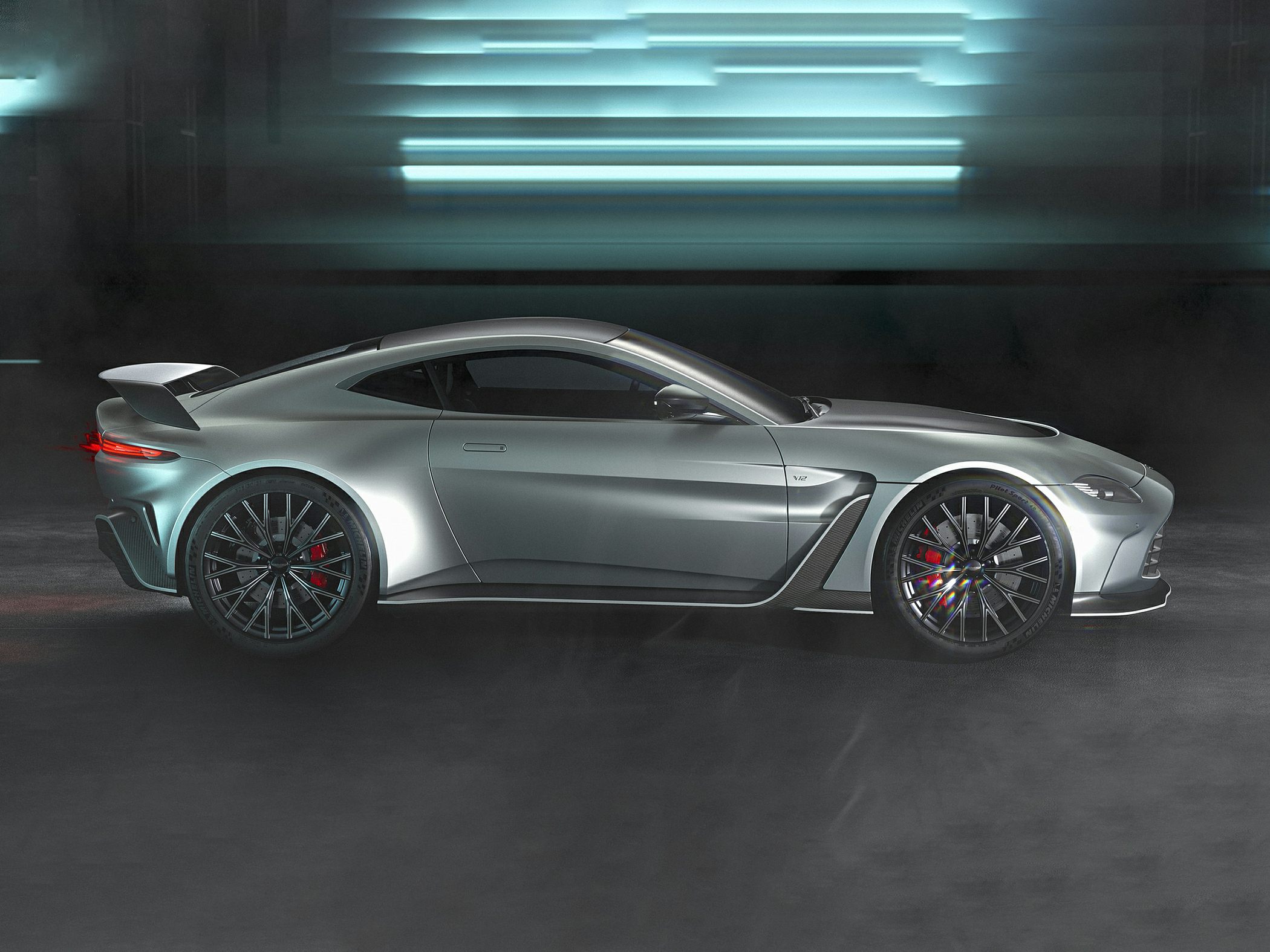 Aerodynamic side profile with rear wing and sharp lines
