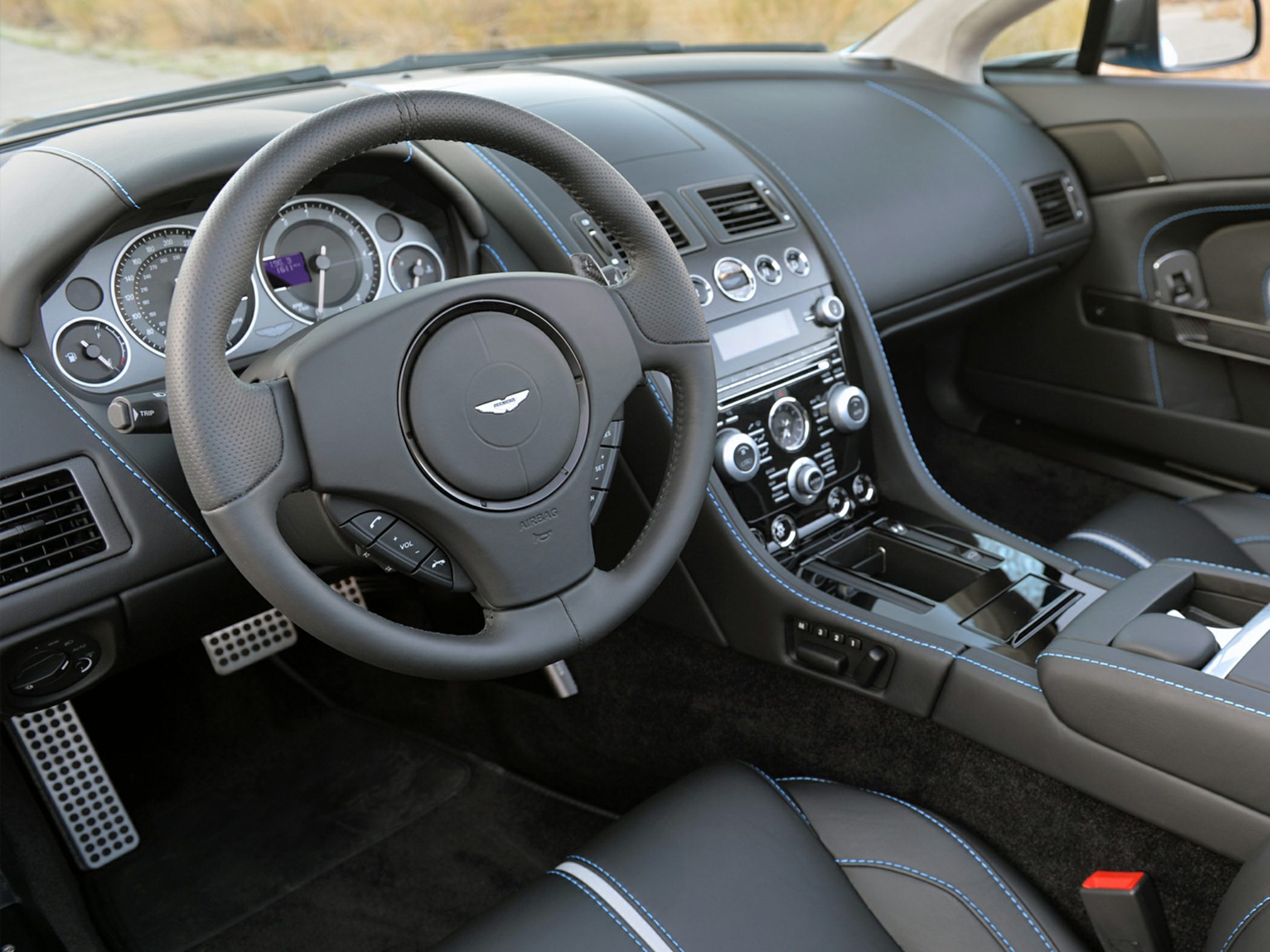 Luxury car interior with leather seats and advanced dashboard controls